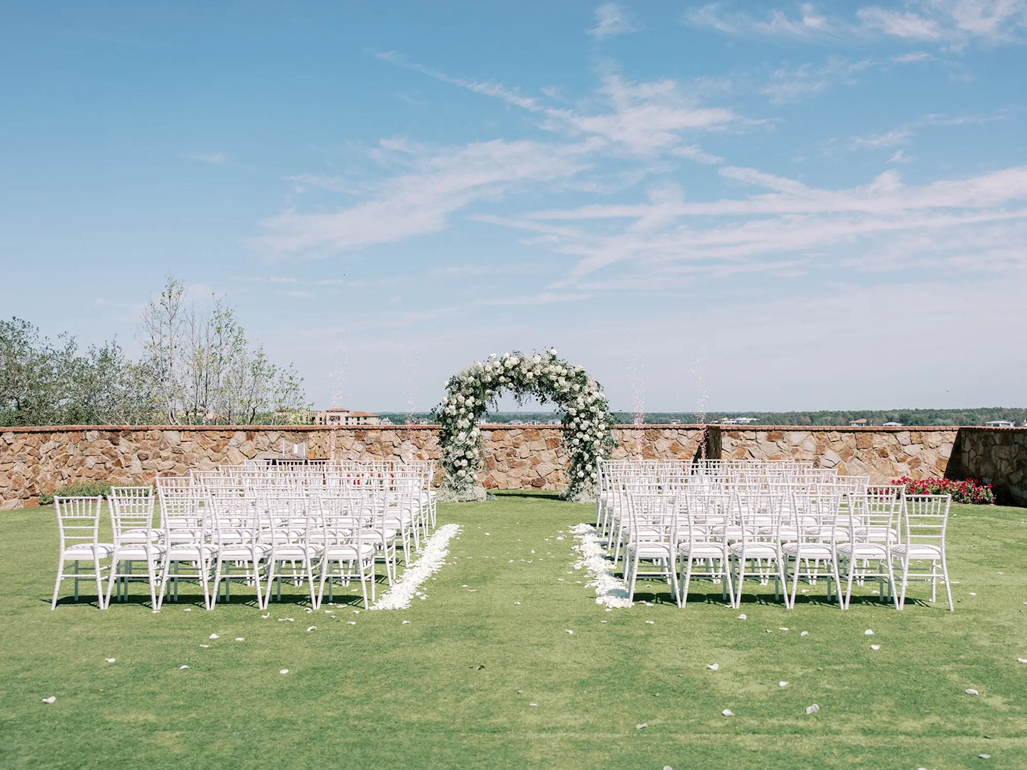 Luxurious Outdoor Italian Inspired Wedding Ceremony Decor Ideas | White Flower and Greenery Altar Inspiration | White Chiavari Chairs