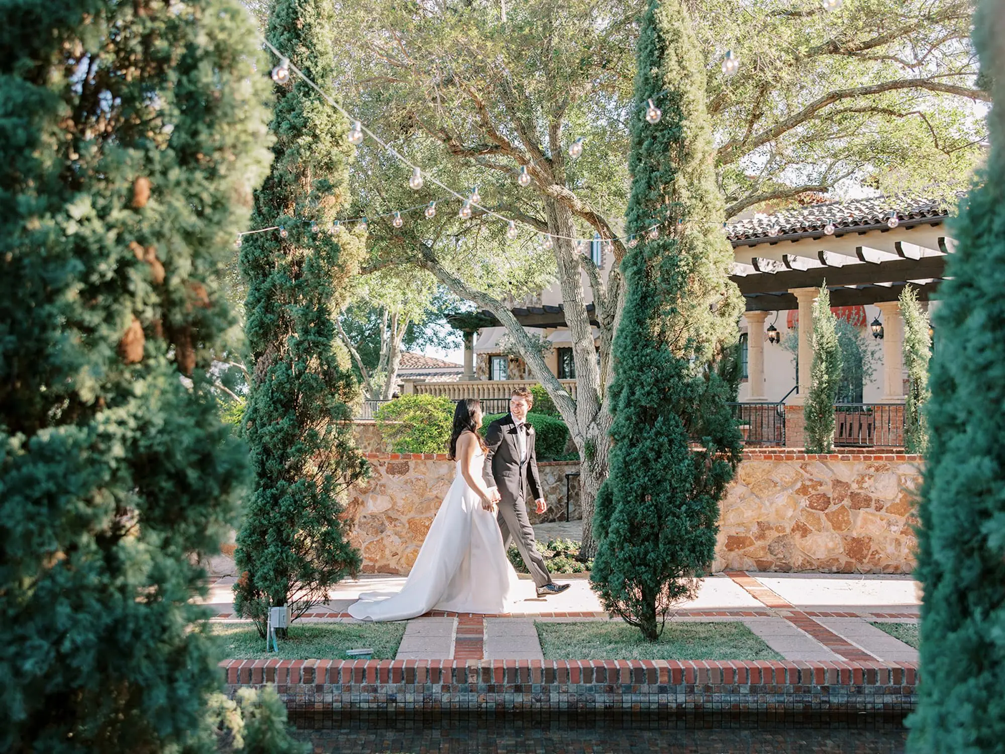 Bride and Groom Wedding Portrait next to Reflecting Pool with Ocean View Wedding Reception Venue Ideas | Spring Florida Outdoor Wedding Inspiration | Tuscan Style Venue Ideas | Event Venue Bella Collina | South Tampa Photographer Eddy Almaguer Photography