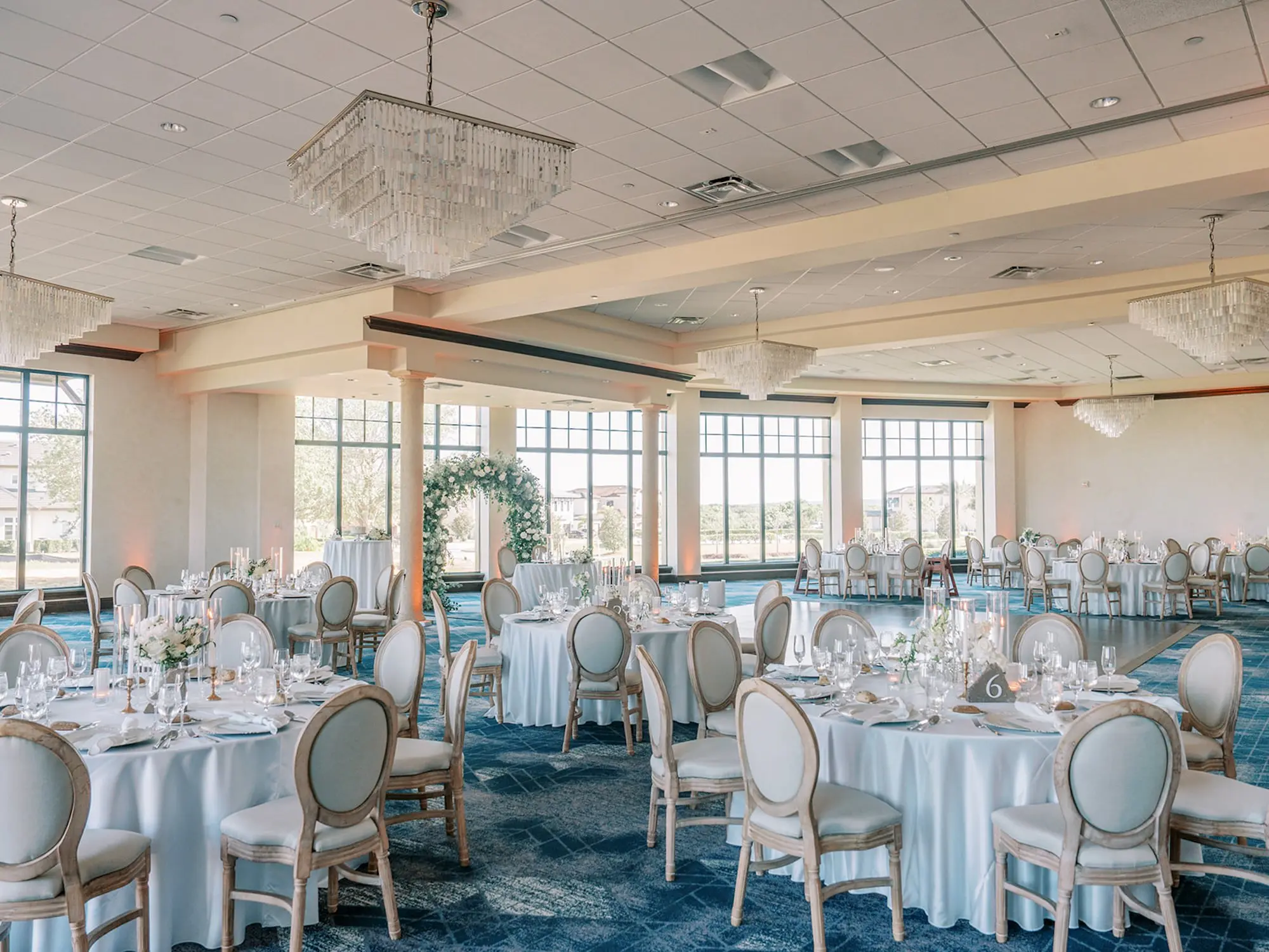 Luxurious Ballroom Wedding Reception | Modern Gold and White King Louis XVI Chairs | Romantic Candlelight Centerpieces Ideas | Event Venue Bella Collina