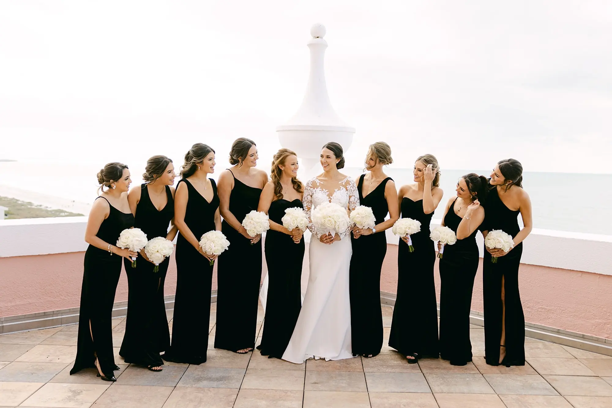 15Luxurious Ivory and Gold Wedding Decor - Luxurious, Ivory and Gold St. Pete Beach Wedding | The Don CeSar Bride with Bridesmaids Wedding Portrait | Mismatched Black Dress Ideas