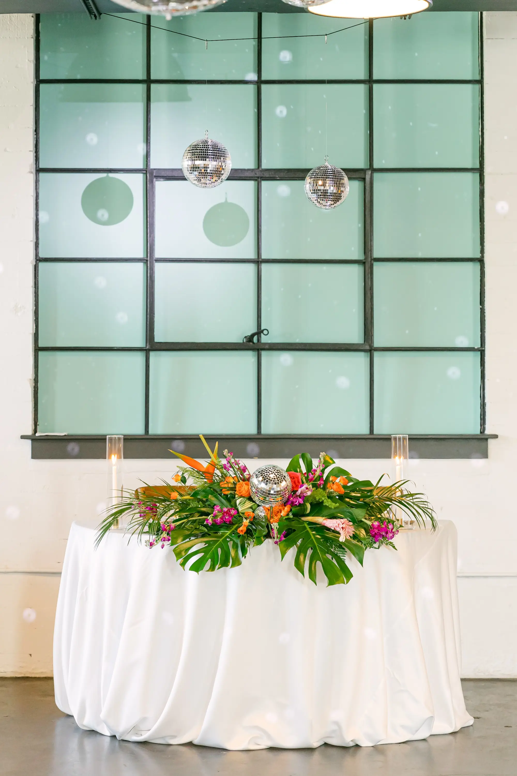 23Flirty Pink Tropical Disco Wedding Inspiration jpg - “Best Of” 2025: Wedding Receptions Part 2 Tropical Disco Wedding Reception Sweetheart Table Decor Ideas | Pink and Orange Flowers with Greenery | The West Events
