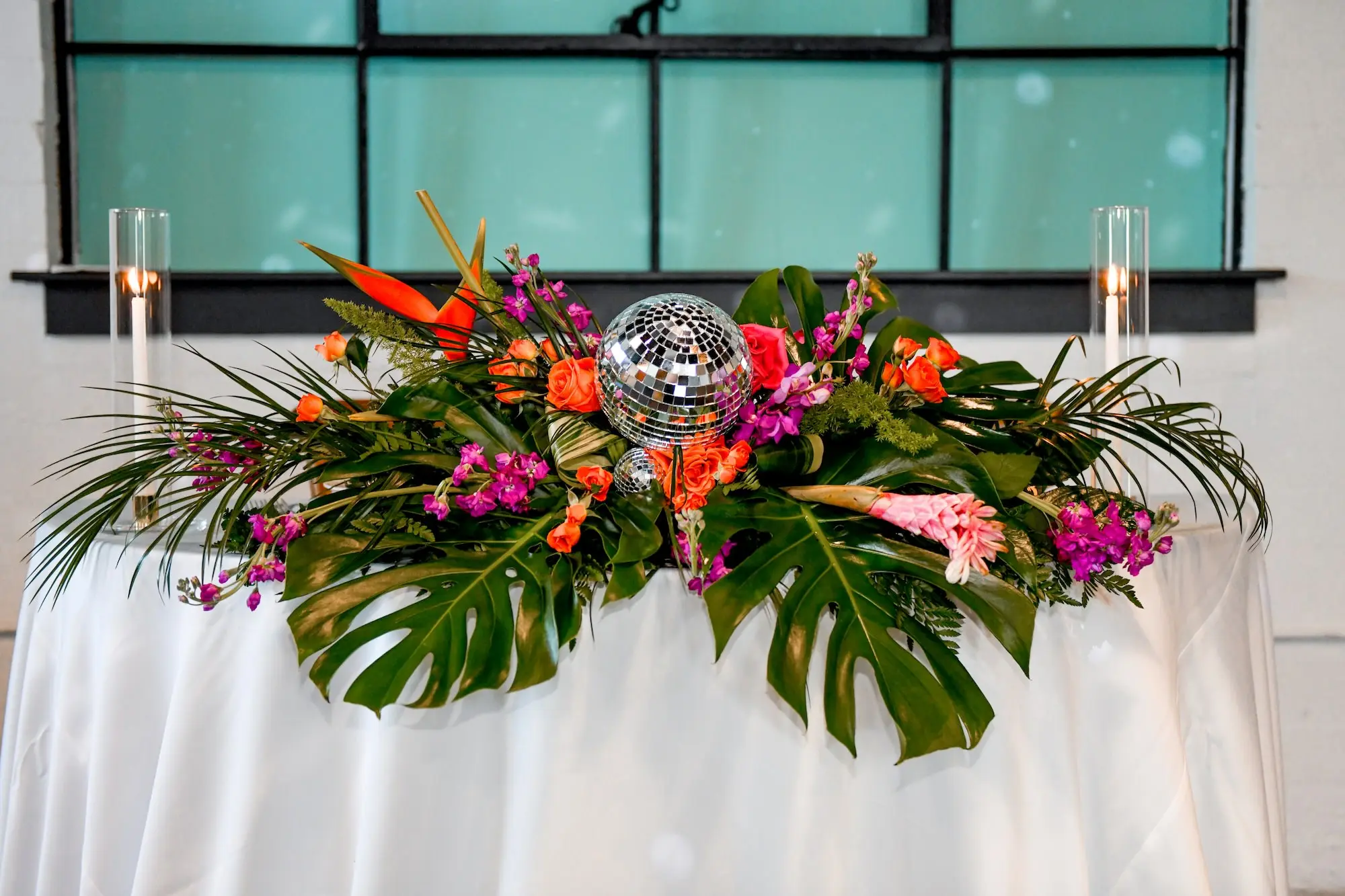 24Flirty Pink Tropical Disco Wedding Inspiration jpg - “Best Of” 2025: Wedding Receptions Part 2 Tropical Disco Wedding Reception Sweetheart Table Decor Ideas | Pink and Orange Flowers with Greenery