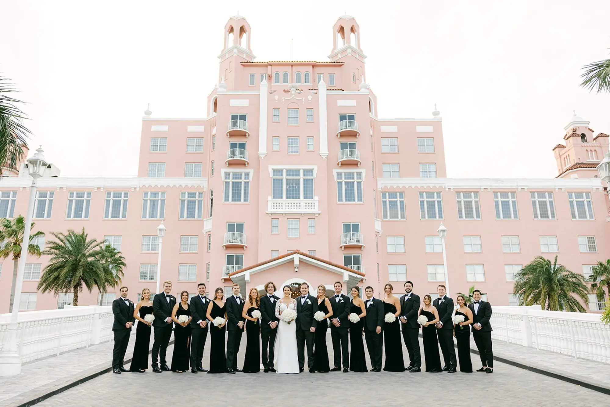 28Luxurious Ivory and Gold Wedding Decor St. Pete Wedding Venue Don CeSar - Luxurious, Ivory and Gold St. Pete Beach Wedding | The Don CeSar Bride and Groom With Bridal Party Wedding Portrait | Black Tie Wedding Attire Inspiration | Tampa Bay Event Venue The Don CeSar