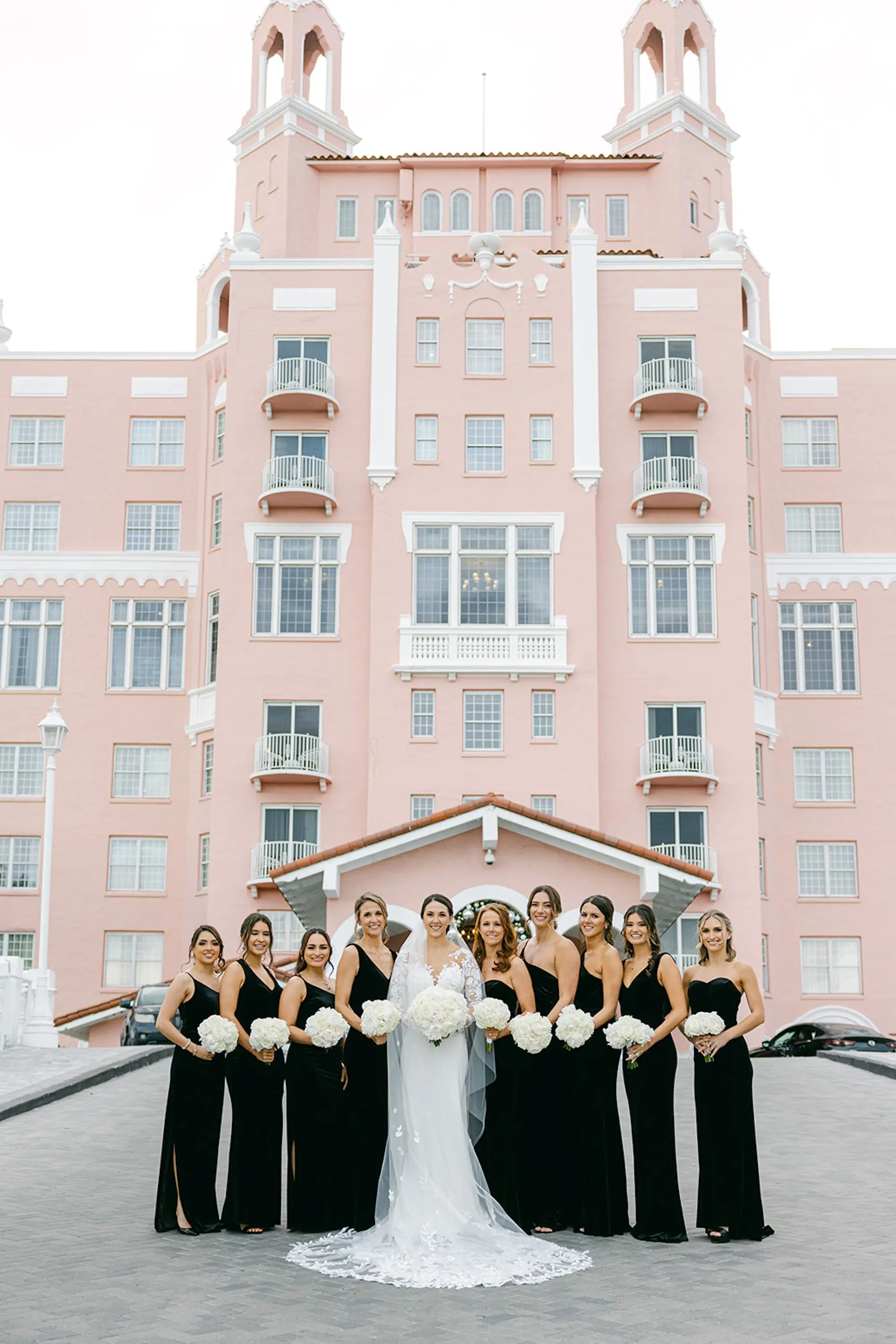 29Luxurious Ivory and Gold Wedding Decor St. Pete Wedding Venue Don CeSar - Luxurious, Ivory and Gold St. Pete Beach Wedding | The Don CeSar Bride with Bridesmaids Wedding Portrait | Black Mismatched Bridesmaids Dress Ideas | St Pete Event Venue The Don CeSar