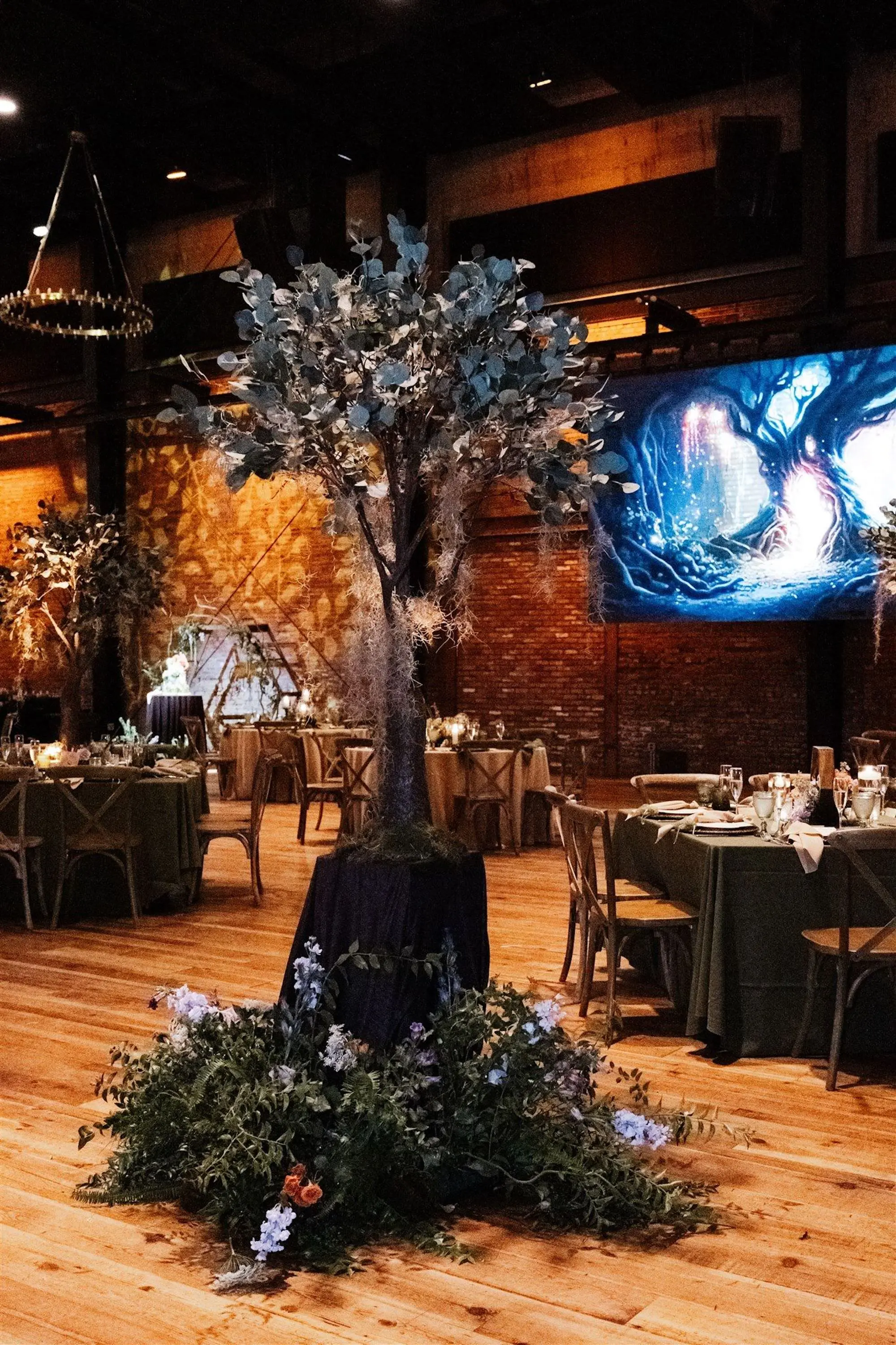 Whimsical Lord of the Rings Wedding Reception Inspiration | Forest Tree Installation Reception Decor Ideas | Elegant Natural Flower Arrangements with Pink, White and Purple Florals in Ferns Ideas | Planner UNIQUE Weddings and Events