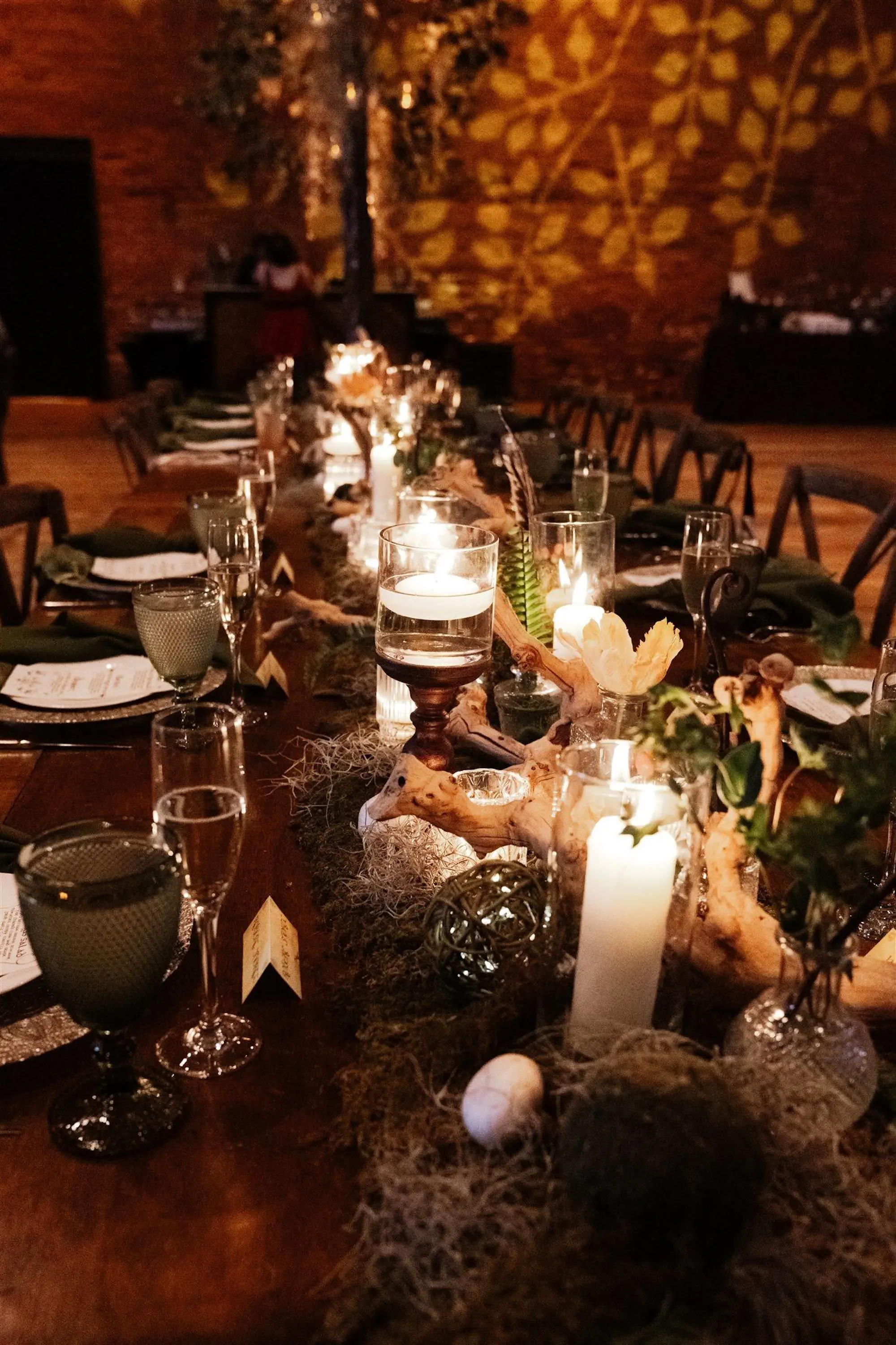 Romantic Fantasy Lord of the Rings Wedding Reception Place Setting Tablescape Centerpiece Decor Ideas | Whimsical Moss, Ferns, Floral Table Garland with Soft Candlelight Inspiration | Tampa Bay Kate Ryan Event Rentals