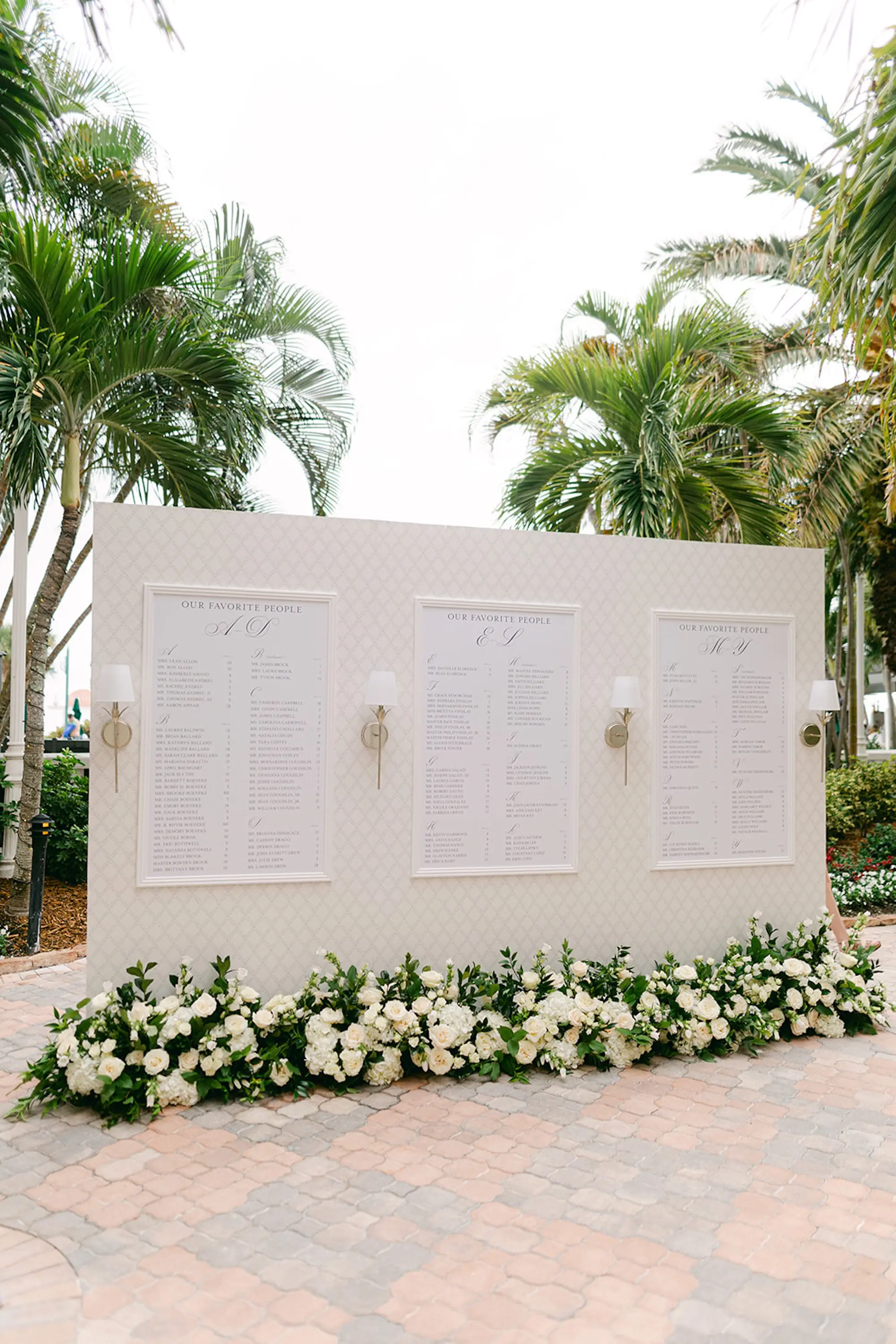 Luxurious White Wedding Reception Seating Chart Display Inspiration | White Roses in Greenery Floral Wedding Ceremony Reception Decor Ideas | Tampa Bay Planner Parties A La Carte