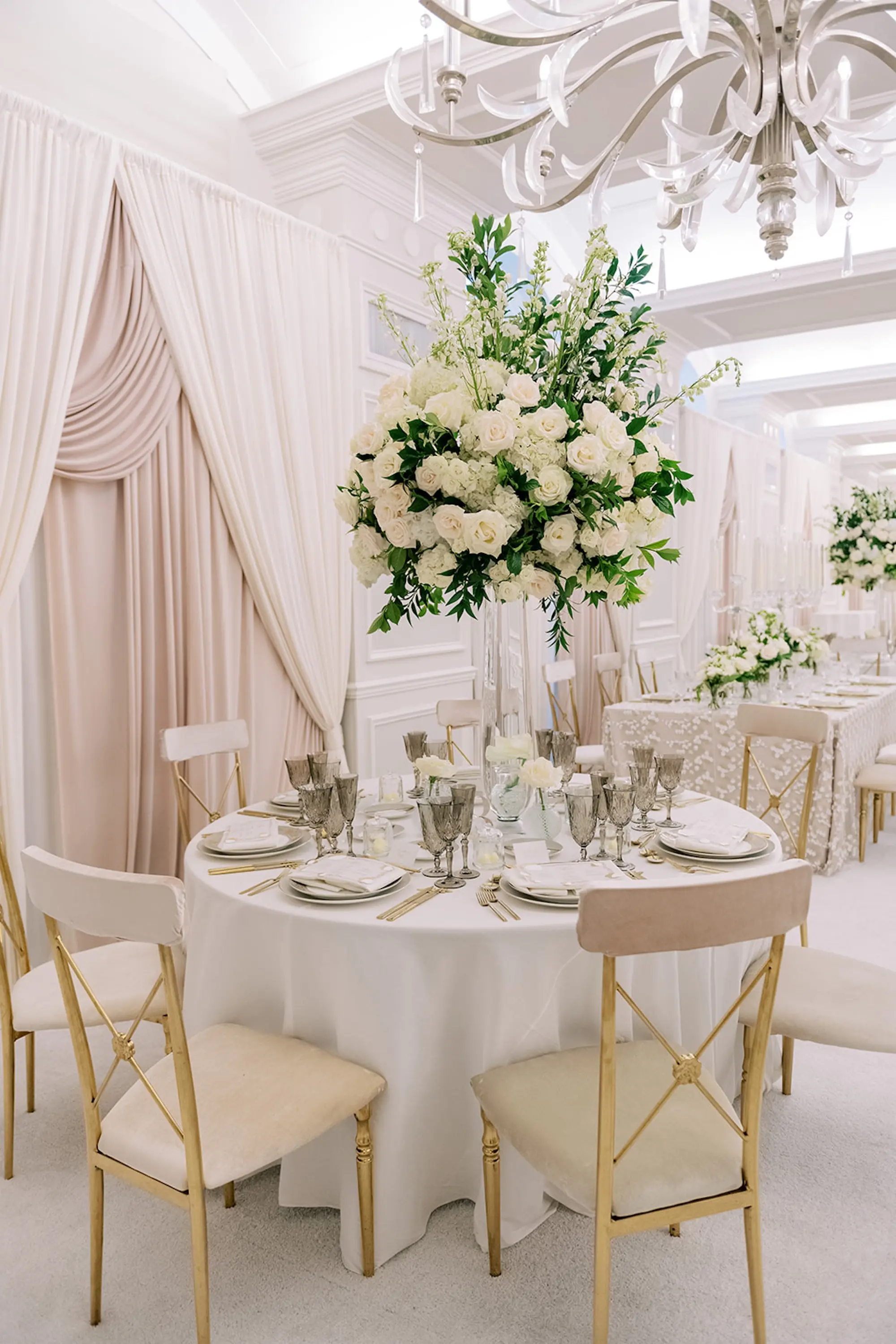 Luxurious Ivory and Gold Ballroom Wedding Reception Decor Inspiration | White and Gold Chairs with White Linen Reception Inspiration | Tall White Roses and Florals in Greenery Wedding Floral Decor Ideas | Tampa Bay Planner Parties A'La Carte | St Pete Beach Historic Hotel Resort Venue The Don CeSar