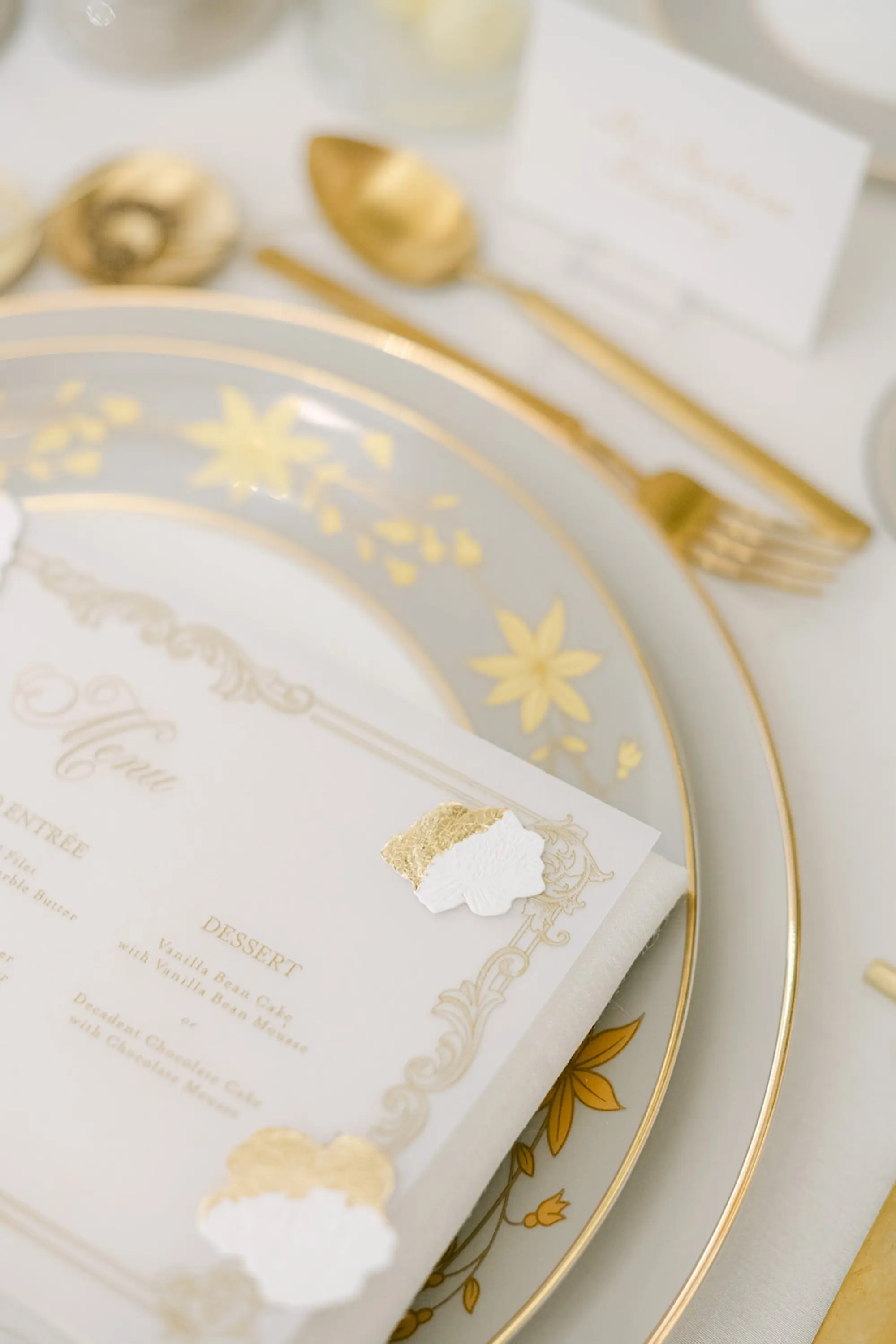 Luxurious White and Gold Floral Detailed China Wedding Reception Place Setting with Acrylic Menu Card and Gold Flatware Decor Inspiration | Tampa Bay Planner Parties A'La Carte