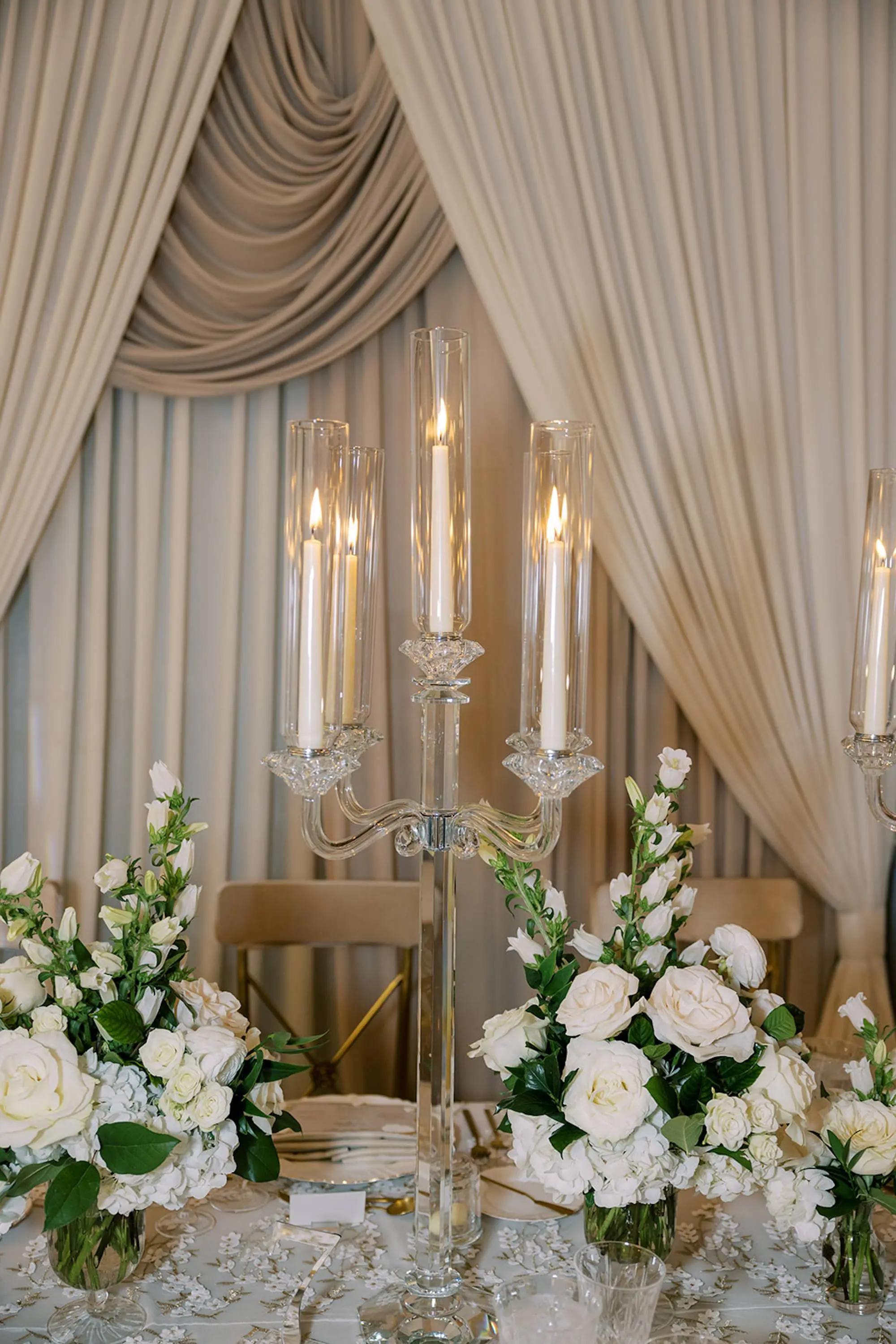 Luxurious Ivory and Gold Wedding Reception Decor Inspiration | Romantic Crystal Candelabra Tablescape Decor Ideas | Classic White Roses Centerpiece Inspiration | Tampa Bay Event Planner Parties A La Carte