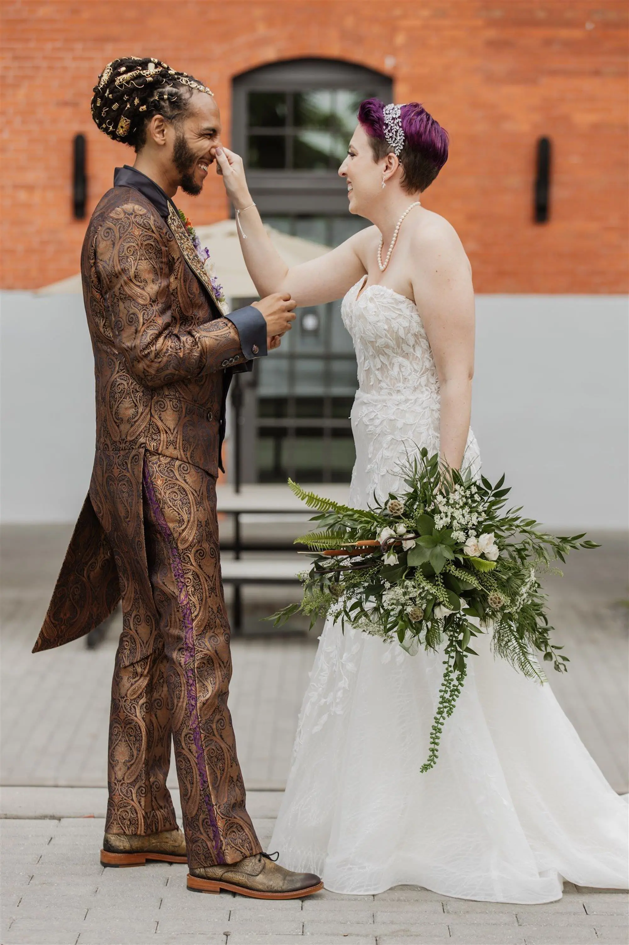 Bride and Groom First Look Wedding Portrait | Freshly Gathered Garden-Style Bridal Wedding Bouquet with Fern Greenery and White Roses, Baby's Breath Ideas | White, Orange, Purple Floral Lapel Boutonniere Inspiration | Patterned Groom's Suit Ideas | Strapless Floral Lace Fit-and-Flare Wedding Gown with Long Train Ideas | Short Wedding Hair Inspiration | Tampa Bay Hair and Makeup Artist Michele Renee The Studio
