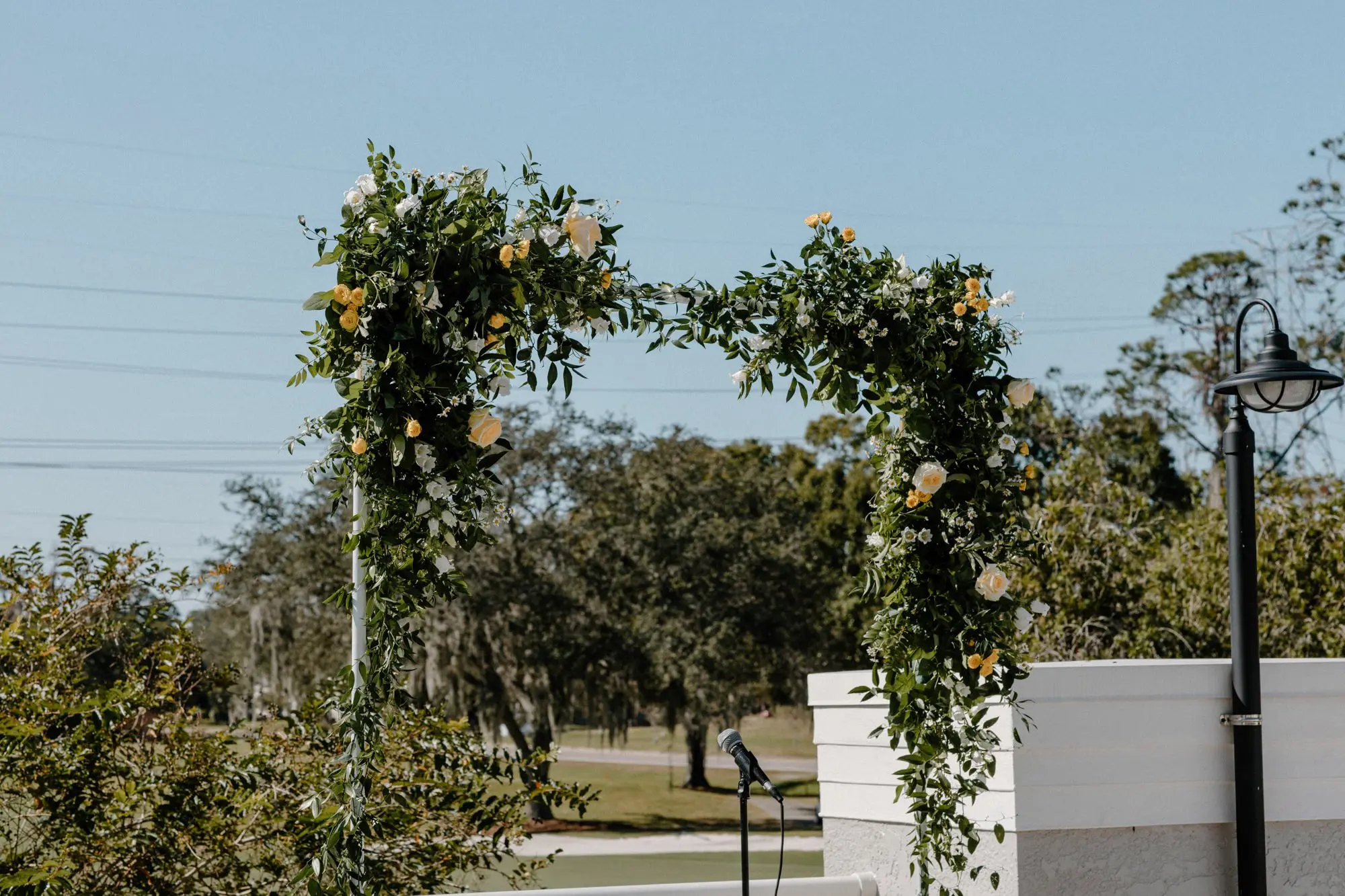 Square Wedding Ceremony Arch with Yellow Roses and White Flowers in Lush Greenery Decor Inspiration | Outdoor Wedding Ceremony Ideas | Fall Florida Outdoor Weddings Inspiration