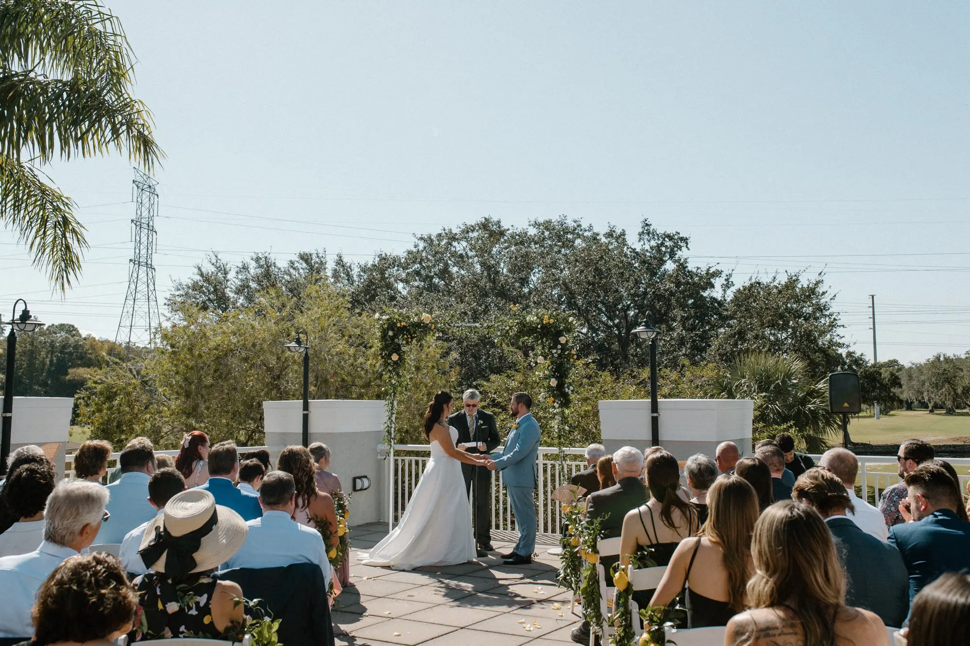 Bride and Groom Wedding Ceremony Vow Exchange Wedding | Oldsmar Outdoor Wedding Venue Ardea Country Club | Country Club Estate Wedding Inspiration | Outdoor Fall Florida Wedding Venue Ideas | Citrus and Garland Wedding Ceremony Aisle Decor Inspiration | Garden Theme Wedding Decor Ideas