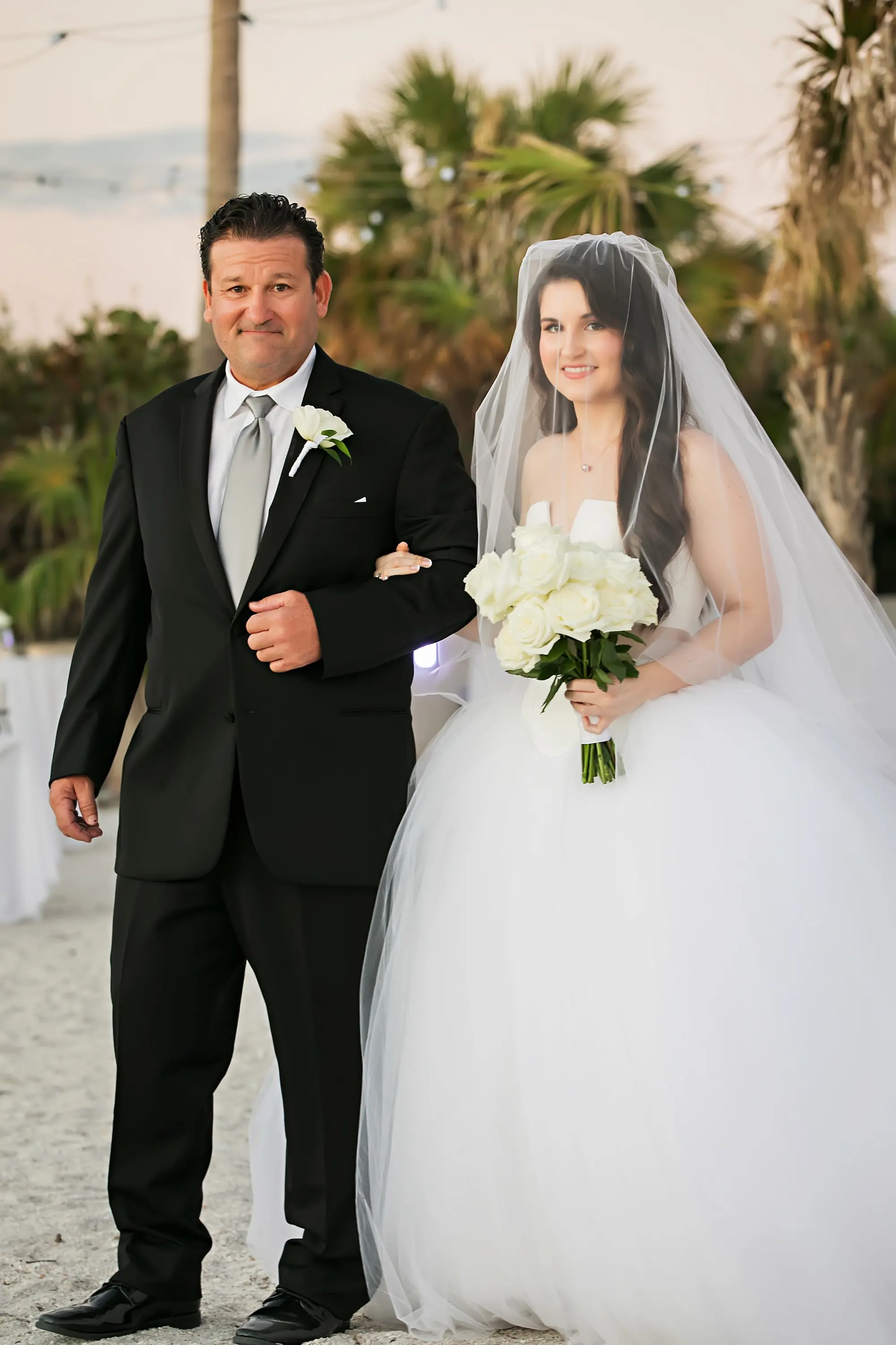 Bride and Father Walking Down Wedding Ceremony Aisle