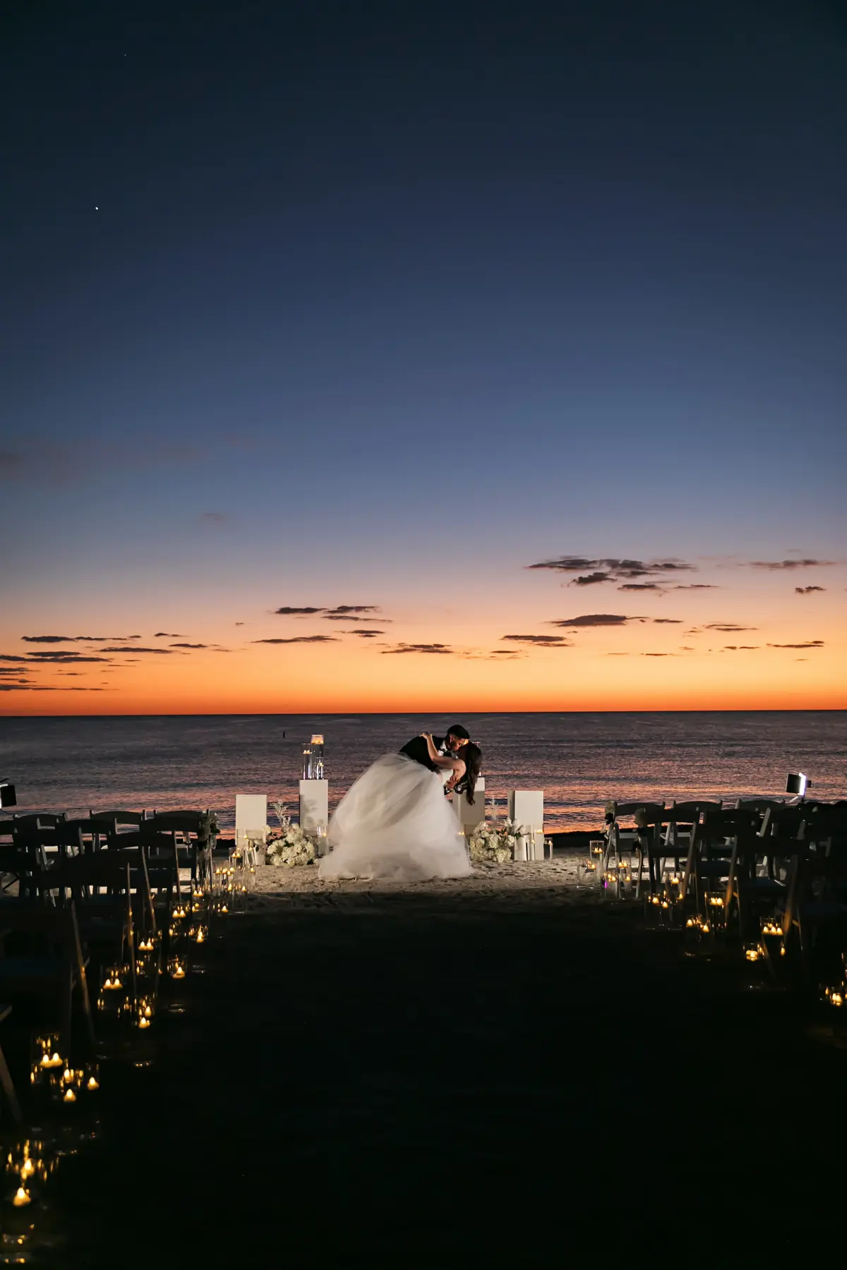 Bride and Groom Sunset Wedding Portrait | Monochromatic White Flower Ceremony Altar Decor Ideas | Sarasota Florist Beneva Flowers | Tampa Bay Photographer Limelight Photography