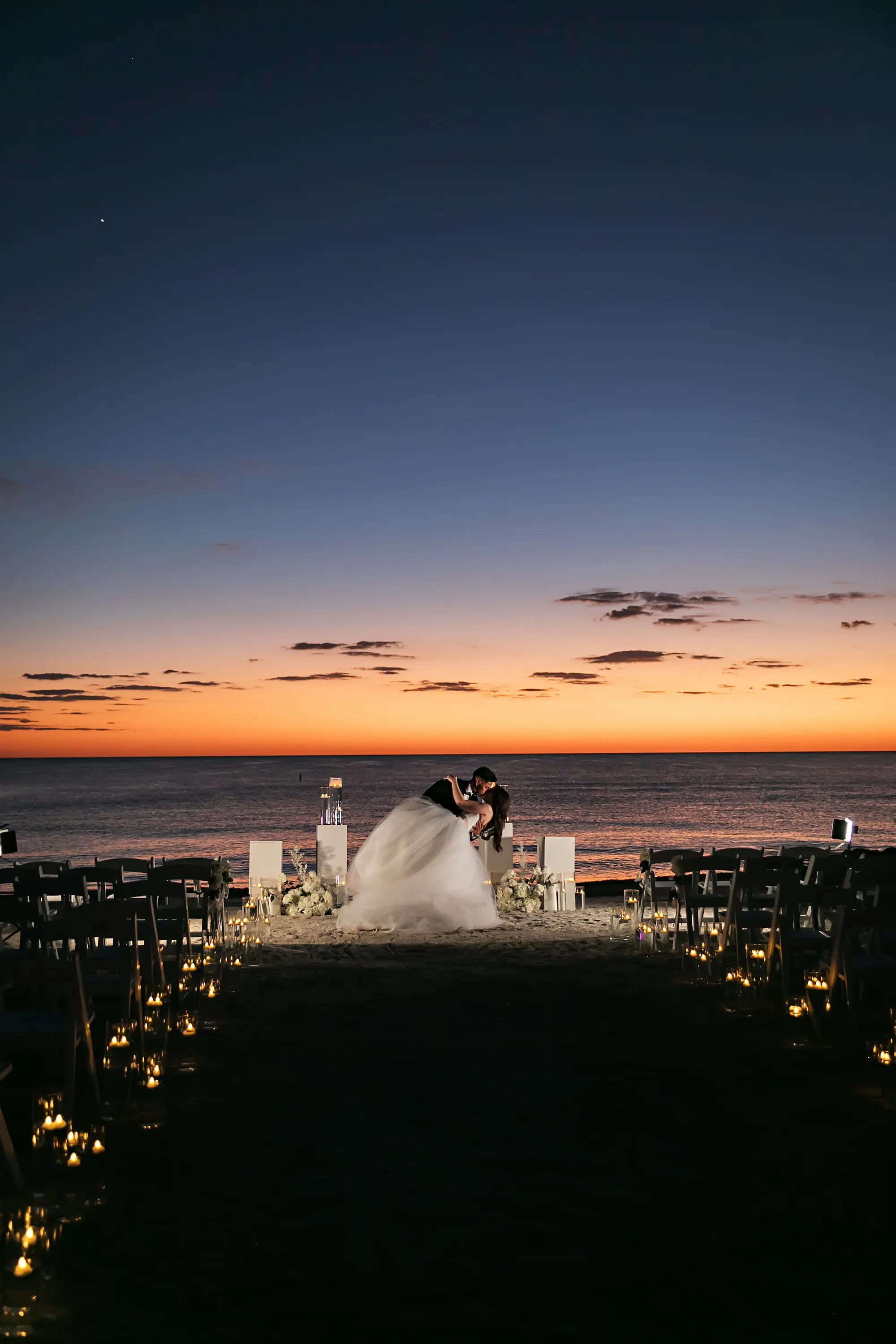 Bride and Groom Sunset Wedding Portrait | Monochromatic White Flower Ceremony Altar Decor Ideas | Sarasota Florist Beneva Flowers | Tampa Bay Photographer Limelight Photography