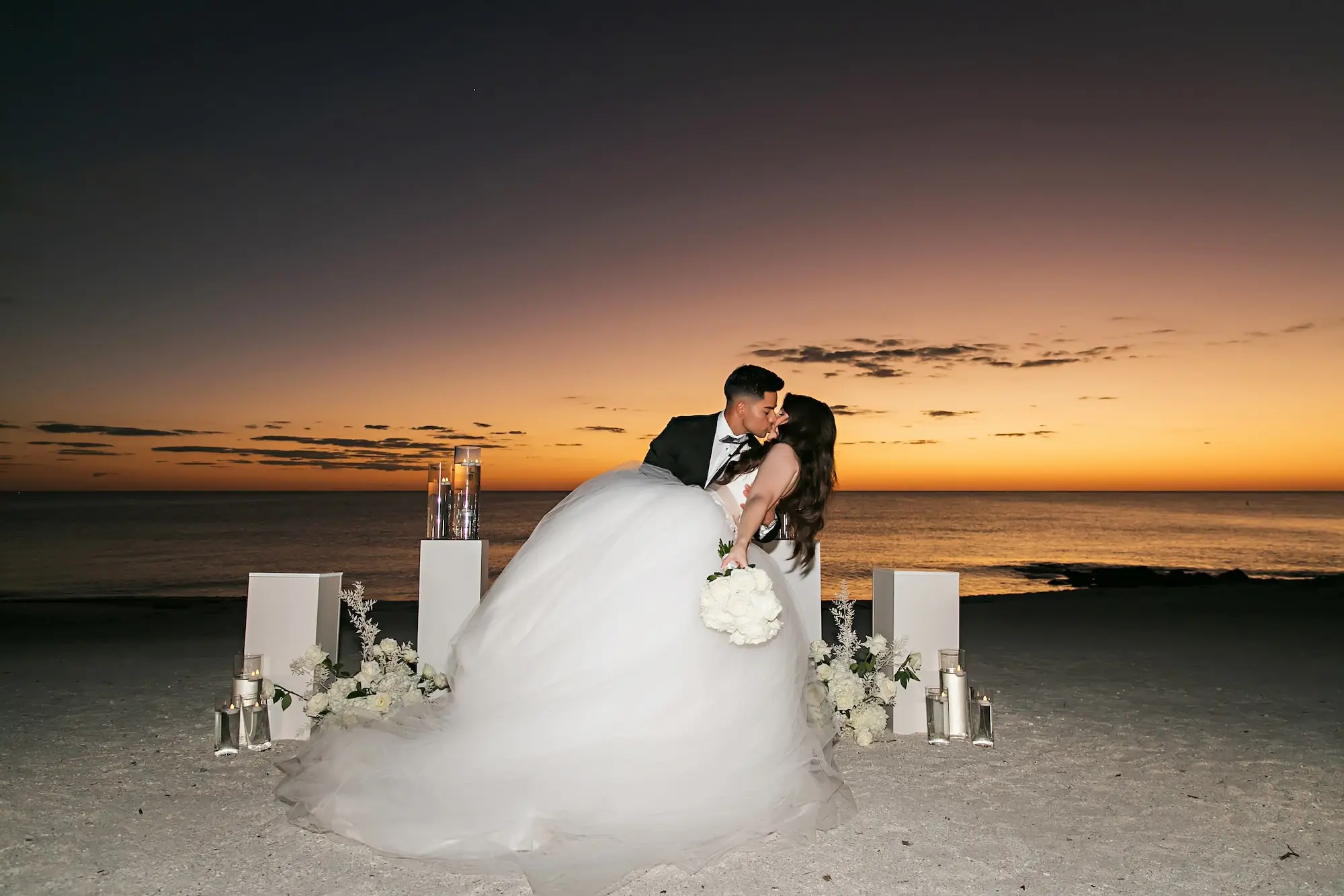 Bride and Groom Sunset Wedding Portrait | Monochromatic White Flower Ceremony Altar Decor Ideas | Sarasota Florist Beneva Flowers | Tampa Bay Photographer Limelight Photography