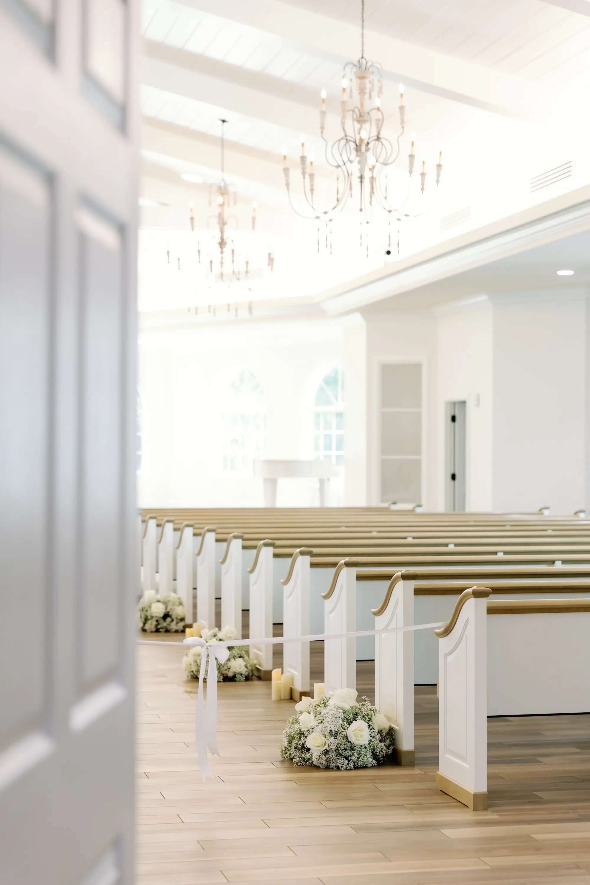 Traditional Church Wedding Ceremony Decor Ideas | Classic White Roses and Baby's Breath Aisle Arrangement Inspiration | Ceremony Venue Harborside Chapel