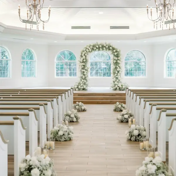 Traditional Church Wedding Ceremony Decor Ideas | Classic White Roses and Baby's Breath Aisle Arrangement Decor and Altar Arch Inspiration | Ceremony Venue Harborside Chapel