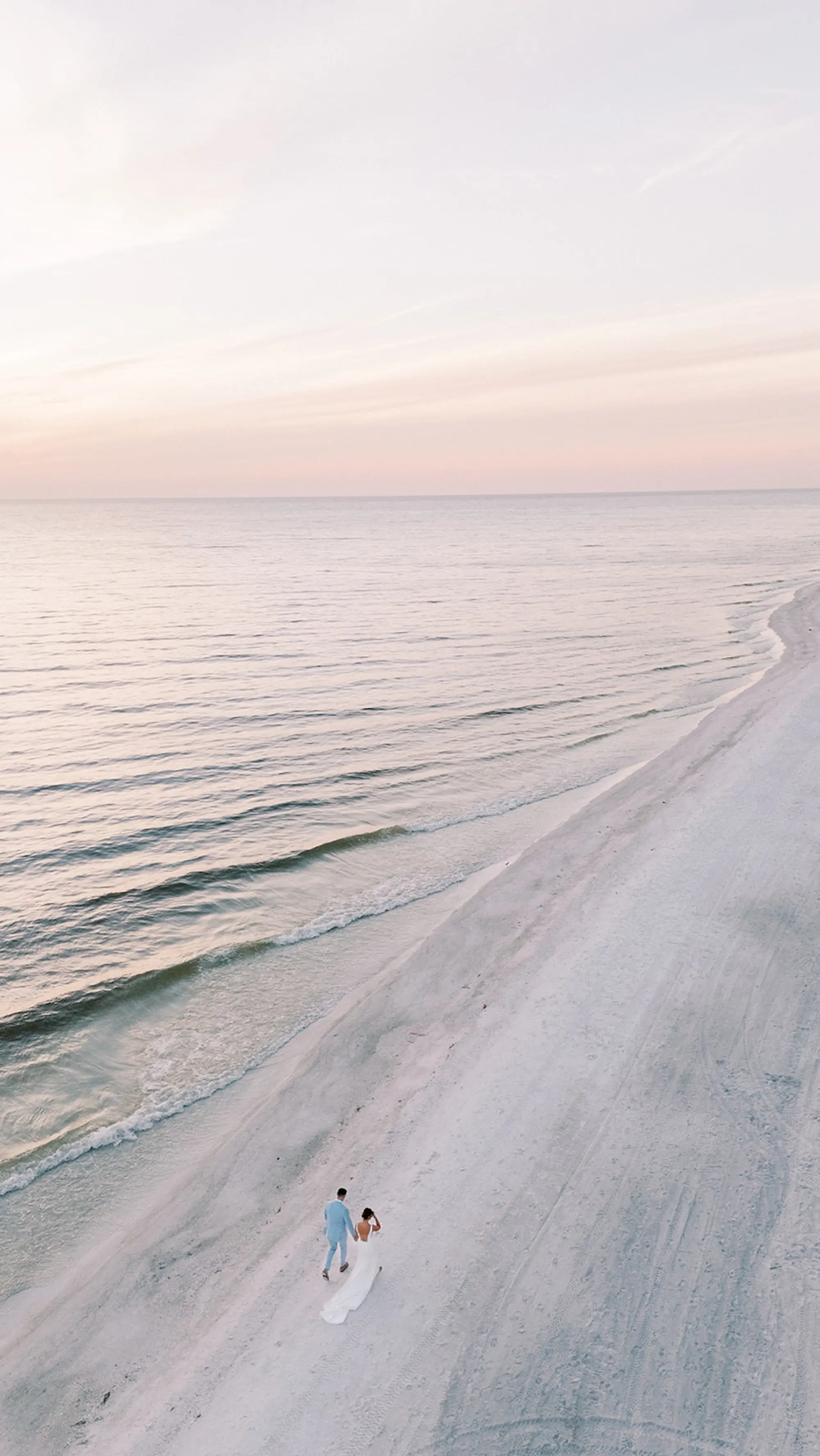 Bride and Groom Walking Down the Beach Overhead Wedding Portrait | South Tampa Photographer Eddy Almaguer Photography
