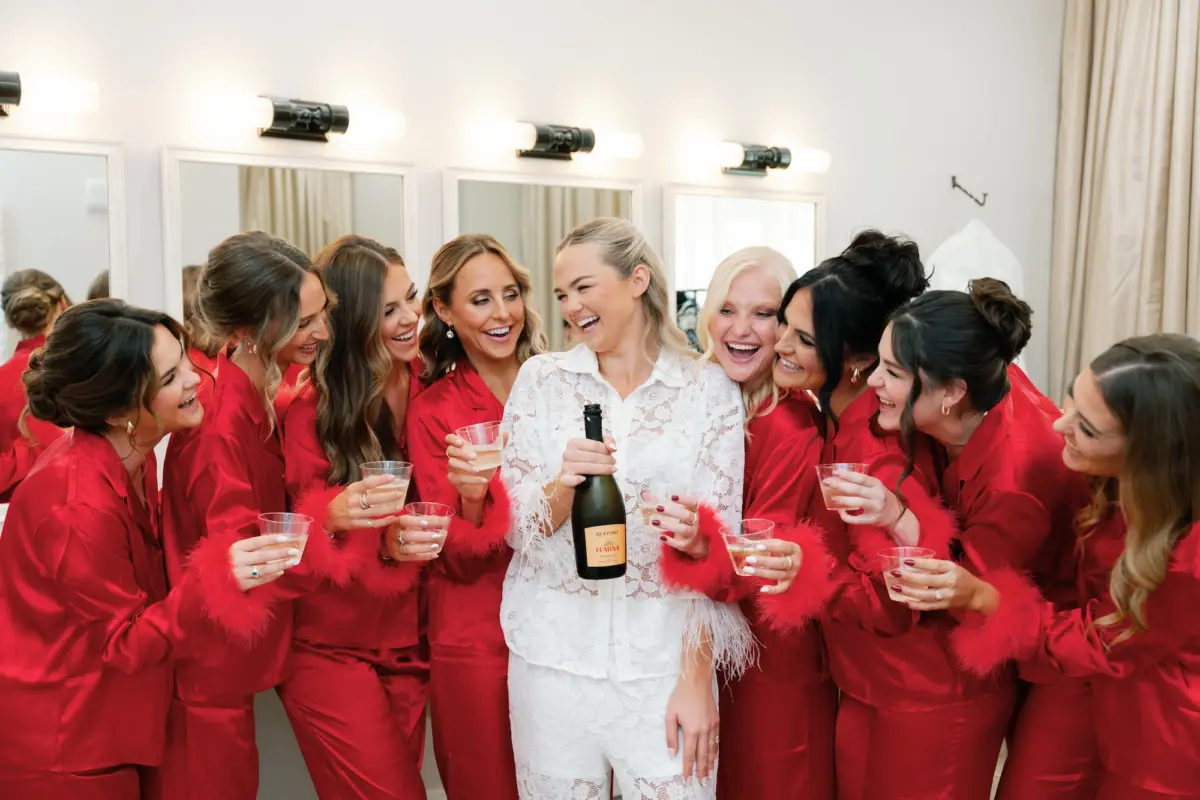 Bride and Bridesmaids Getting Ready Wedding Portrait in Red PJ Sets