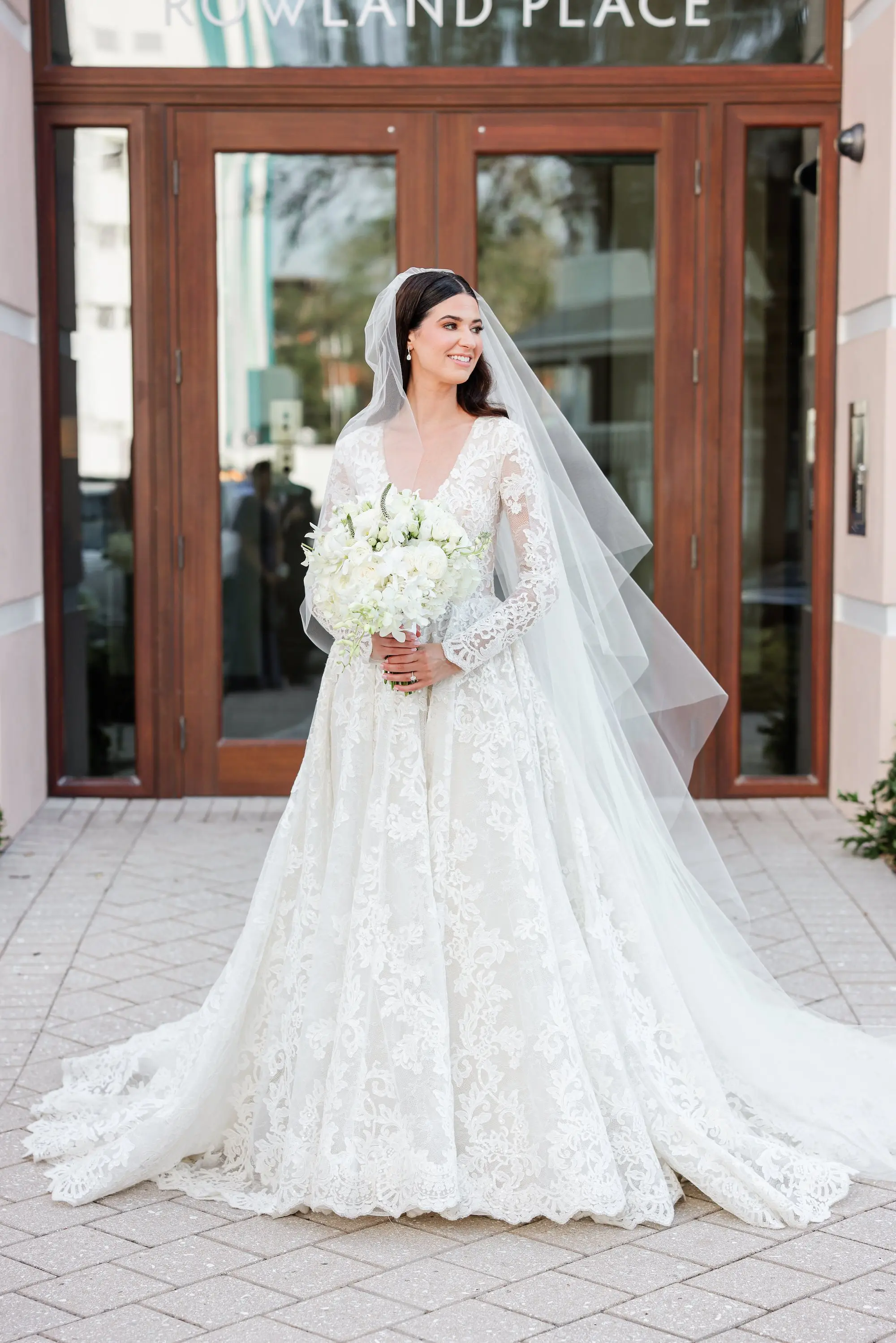 Bride Wedding Portrait | Monochromatic White Roses Bridal Bouquet Inspiration | Timeless White Delicate Long-Sleeved A-line Floral Lace Wedding Gown with V Neck Inspiration | Classic Chiffon Cathedral Length Veil Ideas | Tampa Bay Photographer Lifelong Photography Studio