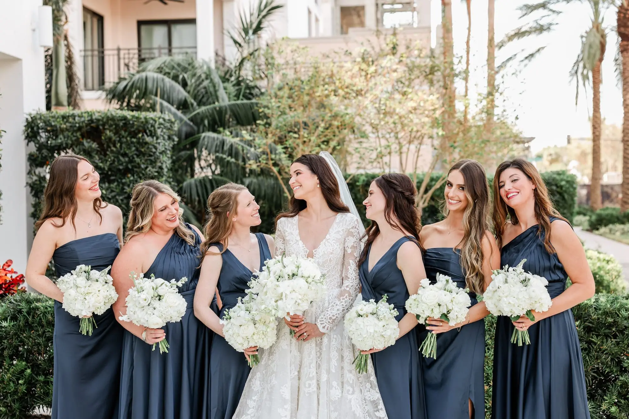 Bride and Bridesmaid Wedding Portrait | Mismatched Navy Blue Satin Bridesmaid Dresses Inspiration | Monochromatic White Roses Bridal Bouquet Ideas | Tampa Bay Photographer Lifelong Photography Studio