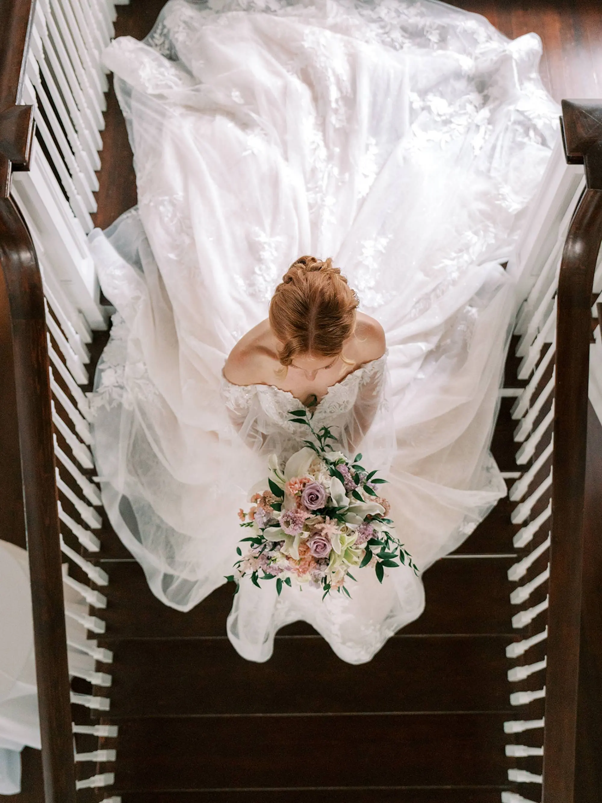 Bride Aerial Staircase Wedding Portrait | Romantic Rapunzel Allure Bridals Disney Fairytale Weddings White Ballgown Wedding Gown with Sweetheart Neckline and Off-the-Shoulder Chiffon Flowy Long Sleeves Inspiration | Pastel Pink, Blush, Lavender, Yellow, Floral Bridal Bouquet Ideas | South Tampa Photographer Eddy Almaguer Photography