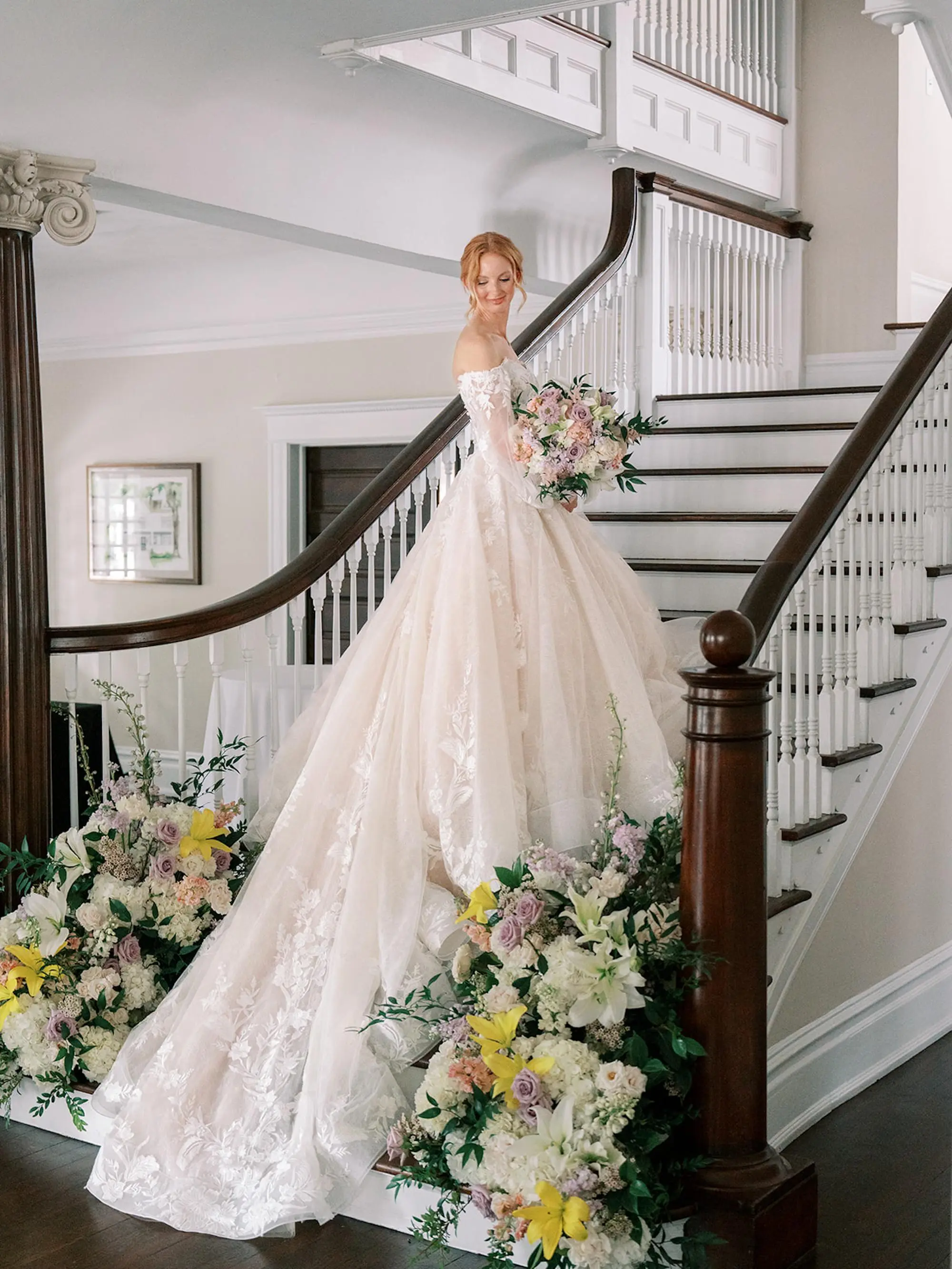 Bride The Orlo Staircase Wedding Portrait | Cathedral Length Chiffon Veil Ideas | Romantic Rapunzel Allure Bridals Disney Fairytale Weddings White Ballgown Wedding Gown with Sweetheart Neckline and Off-the-Shoulder Chiffon Flowy Long Sleeves Inspiration | Pastel Pink, Blush, Lavender, Yellow, Floral Bridal Bouquet Ideas | South Tampa Photographer Eddy Almaguer Photography