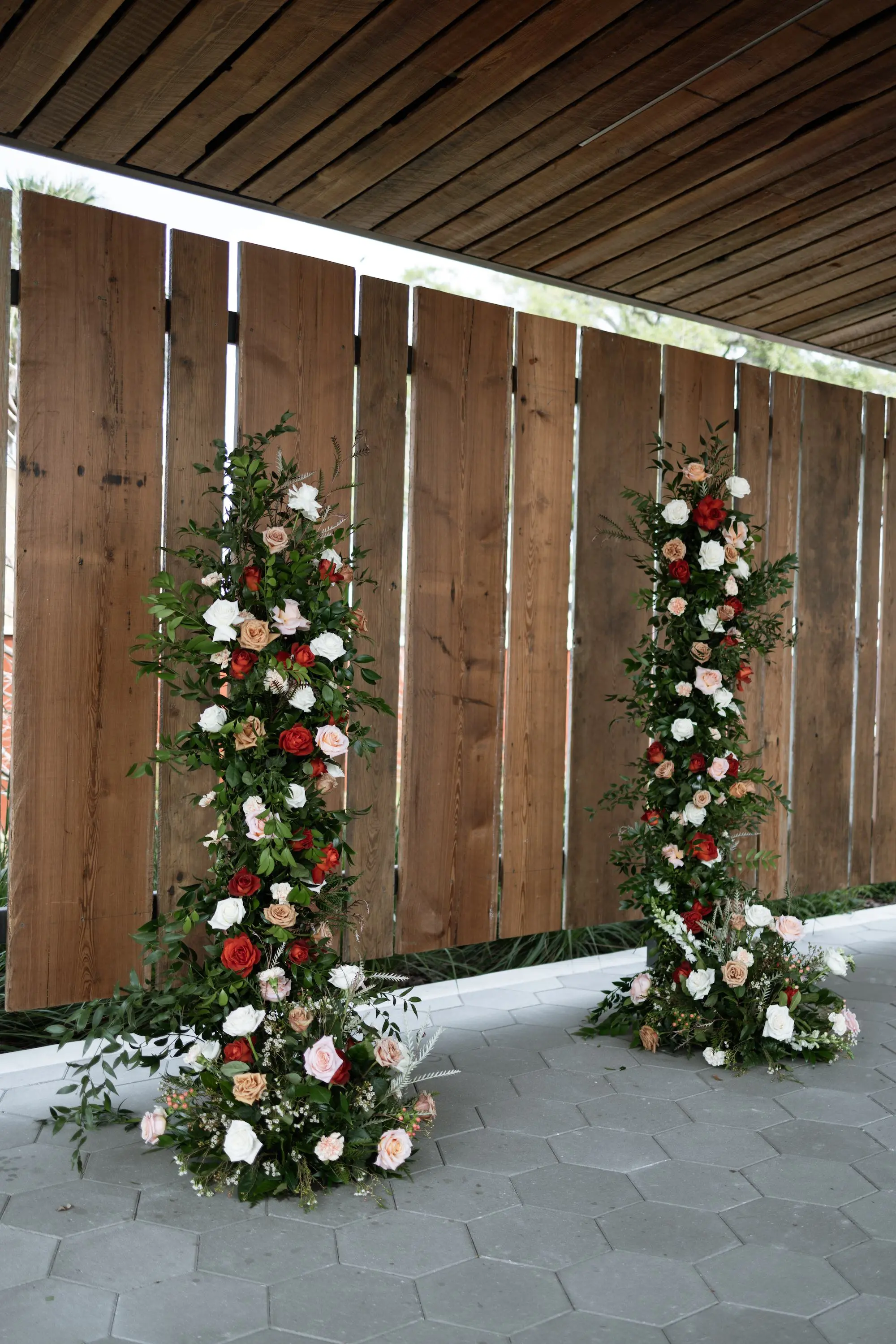 Vintage Old Florida Wedding Ceremony Altar Backdrop Decor Inspiration | Pink, White, and Red Flowers with Greenery