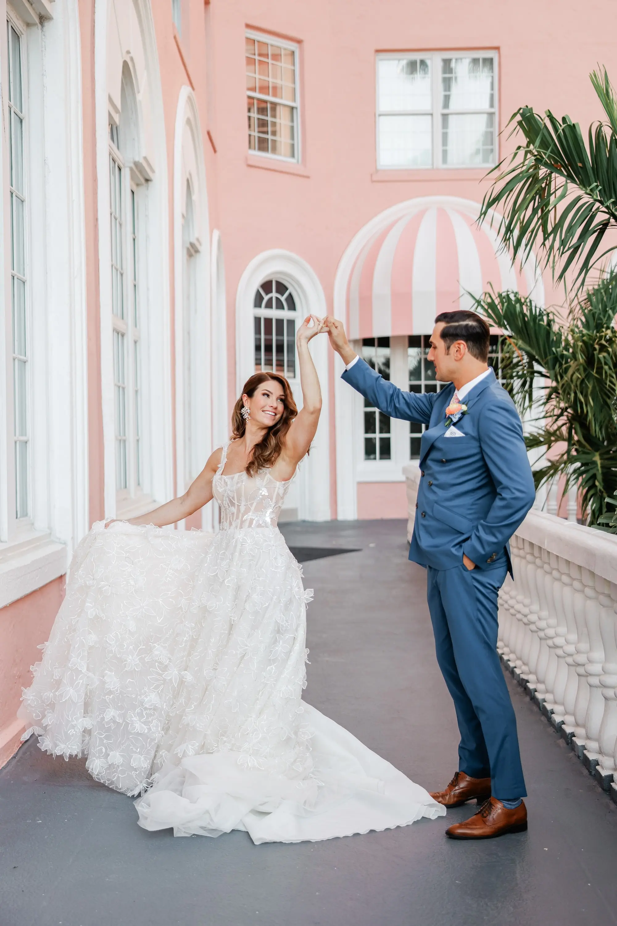 Bride and Groom First Look Wedding Portrait | Lace and Tulle Galia Lahav Wedding Gown with Fitted Bodice and Full Layered, Ruffled Skirt and Train Ideas | Blue Groom Suit Inspiration | Soft, Romantic Beach Curls Bridal Hair Ideas | Ybor Hair and Makeup Artist Adore Bridal Hair and Makeup | Venue St. Pete Beach Don CeSar | Tampa Bay Planner Blue Skies Weddings and Events | St Pete Photographer Lifelong Photography Studio