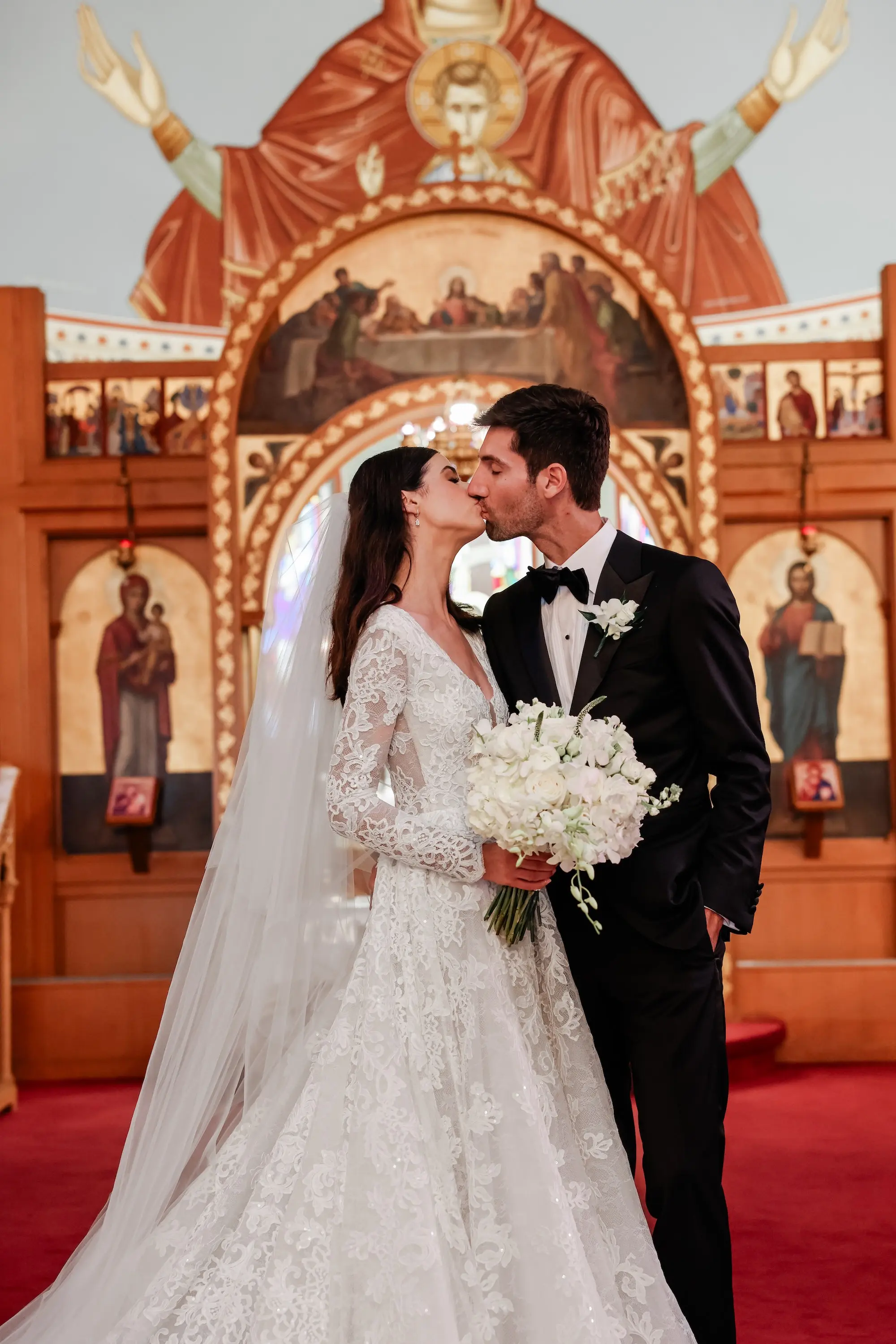 Bride and Groom Traditional Greek Orthodox Wedding Ceremony Inspiration | Monochromatic White Bridal Bouquet Ideas | Wedding Ceremony Venue St. John Baptist Greek Orthodox Church | Tampa Bay Wedding Photographer Lifelong Photography Studio