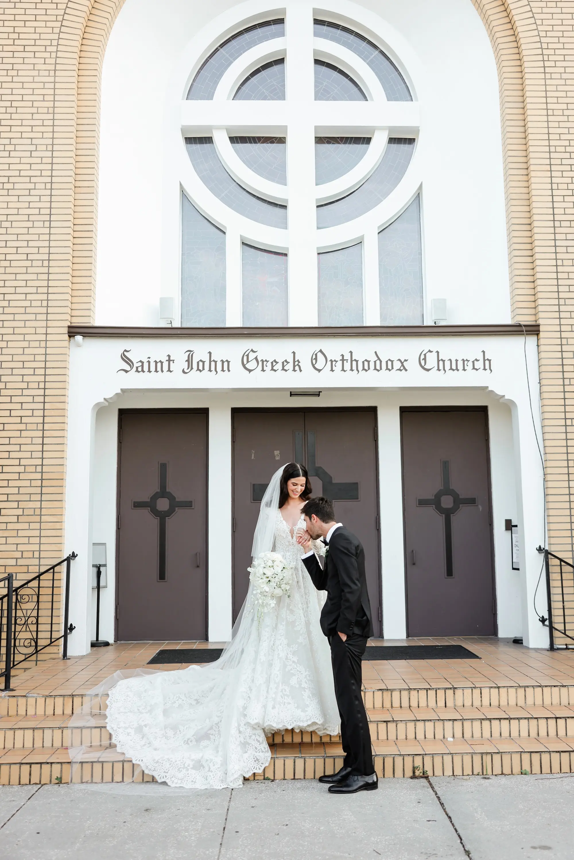 Bride and Groom Traditional Greek Orthodox Wedding Ceremony Inspiration | Monochromatic White Bridal Bouquet Ideas | Wedding Ceremony Venue St. John Baptist Greek Orthodox Church | Tampa Bay Wedding Photographer Lifelong Photography Studio