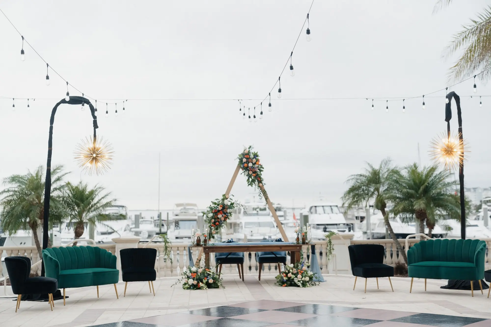 Wooden Triangle Backdrop with Orange and Blue Flowers, and Greenery Floral Display Ideas | Tampa Bay Florist Save The Date Florida | Event Venue Westshore Yacht Club | Planner Oh My Occasions