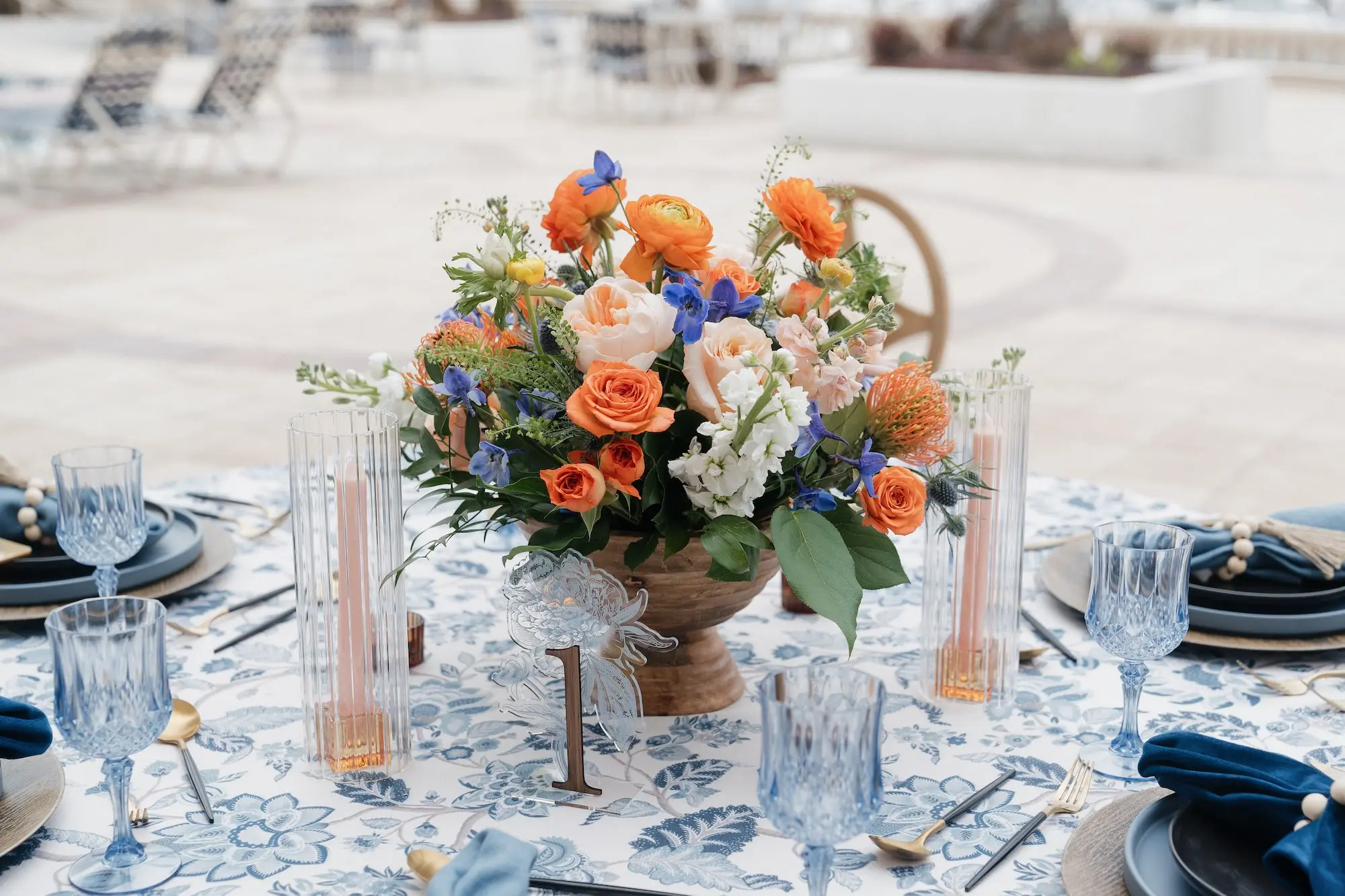 Romantic Spring Wedding Reception Centerpiece Ideas | Orange, Blue, Pink, and White Flowers with Greenery Floral Arrangement | Tampa Bay Florist Save The Date Florida