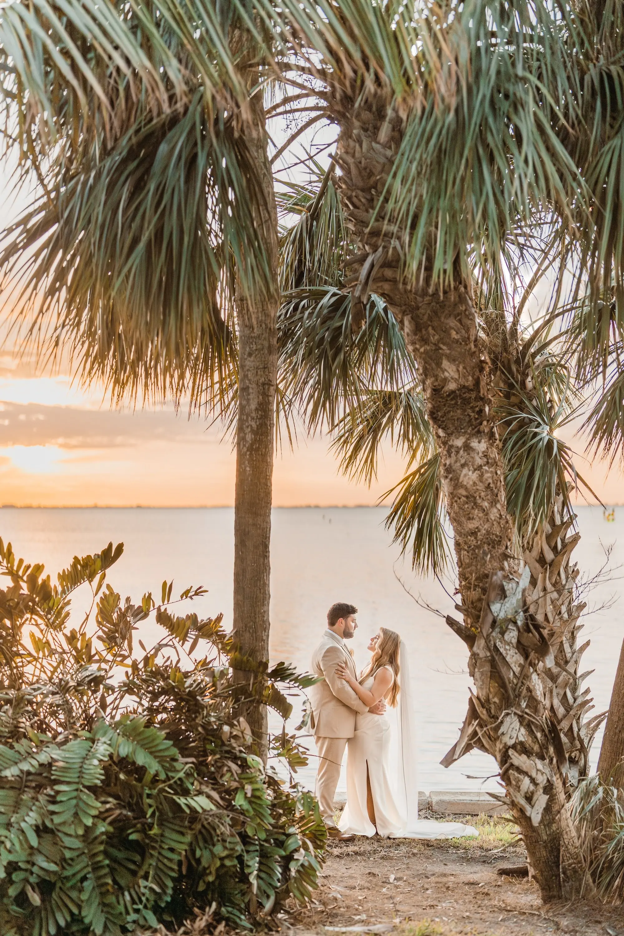 Bride and Groom Waterfront Sunset Wedding Portrait