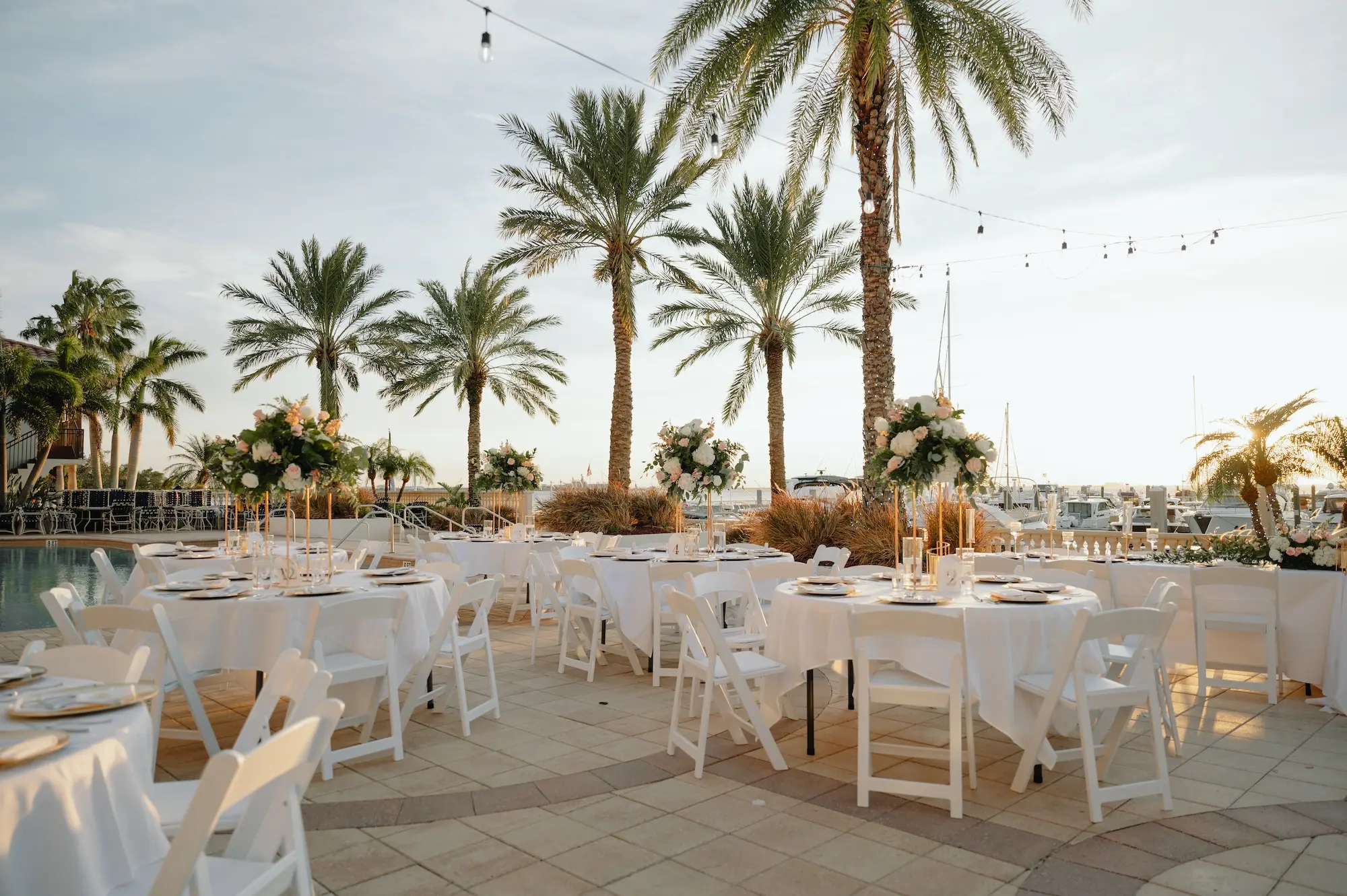 28Romantic Rose Gold and Champagne Wedding Ideas Tampa Waterfront Venue Westshore Yacht Club - “Best Of” 2025: Wedding Receptions Part 2 Rose Gold and Champagne Outdoor Waterfront Wedding Reception Decor Inspiration | White Chairs with White Linens and Sting Bistro Lights Decor Ideas | Tampa Bay Florida Waterfront Wedding Venue Westshore Yacht Club