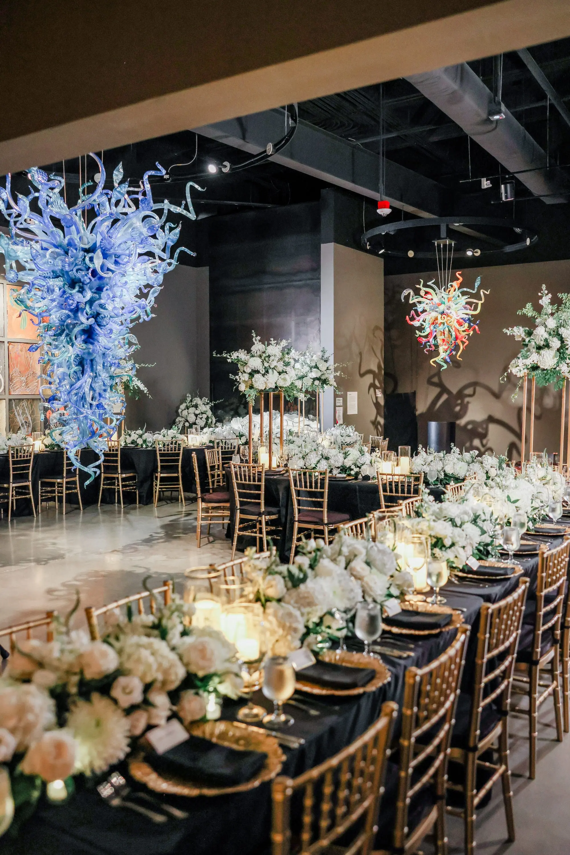 29Classic White Chic St Pete Museum Wedding Inspiration Venue Chihuly Collection - “Best Of” 2025: Wedding Receptions Part 2 Elegant Ballroom Wedding Reception | Gold Chiavari Chairs | Tall Gold Centerpieces with White Hydrangeas, Roses and Orchid Flower Arrangement Ideas | St Pete Elite Events Catering | Venue The Chihuly Collection at the Morean Arts Center | Tampa Bay Planner Coastal Coordinating