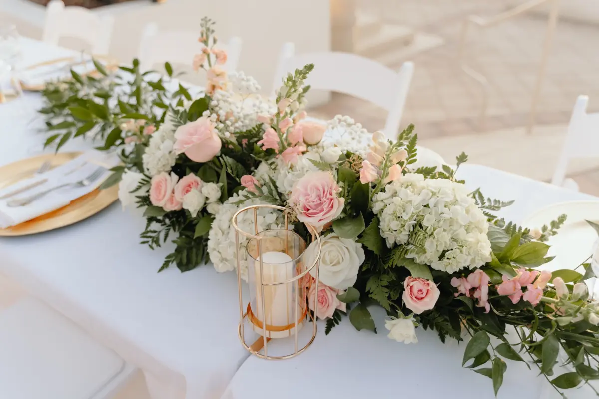 White and Pink Roses, White Baby's Breath and White Hydrangeas in Greenery Flower Arrangement Wedding Reception Centerpiece Decor Inspiration