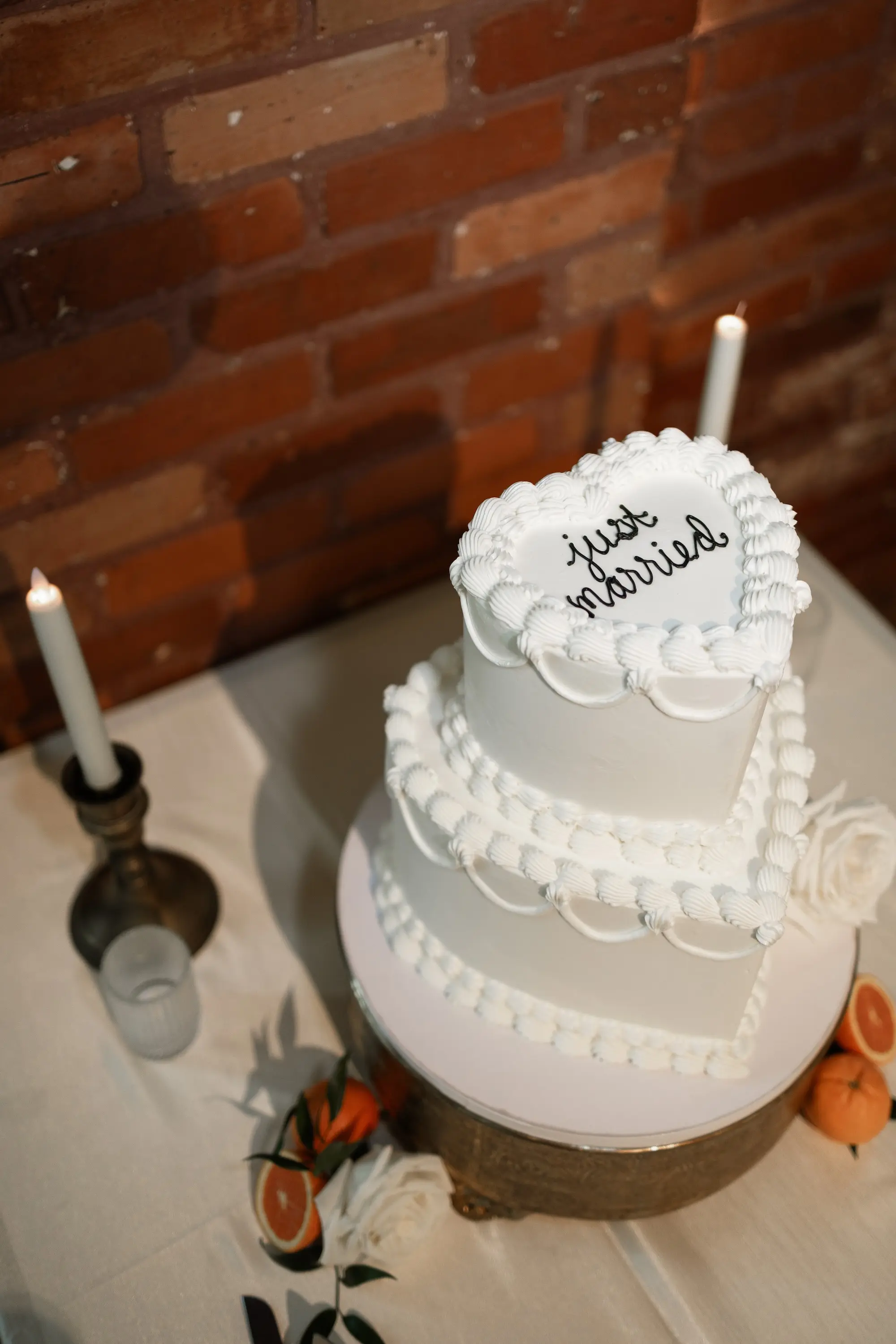 Two-Tiered Heart Shaped Vintage Wedding Cake with Black Icing Just Married Inspiration