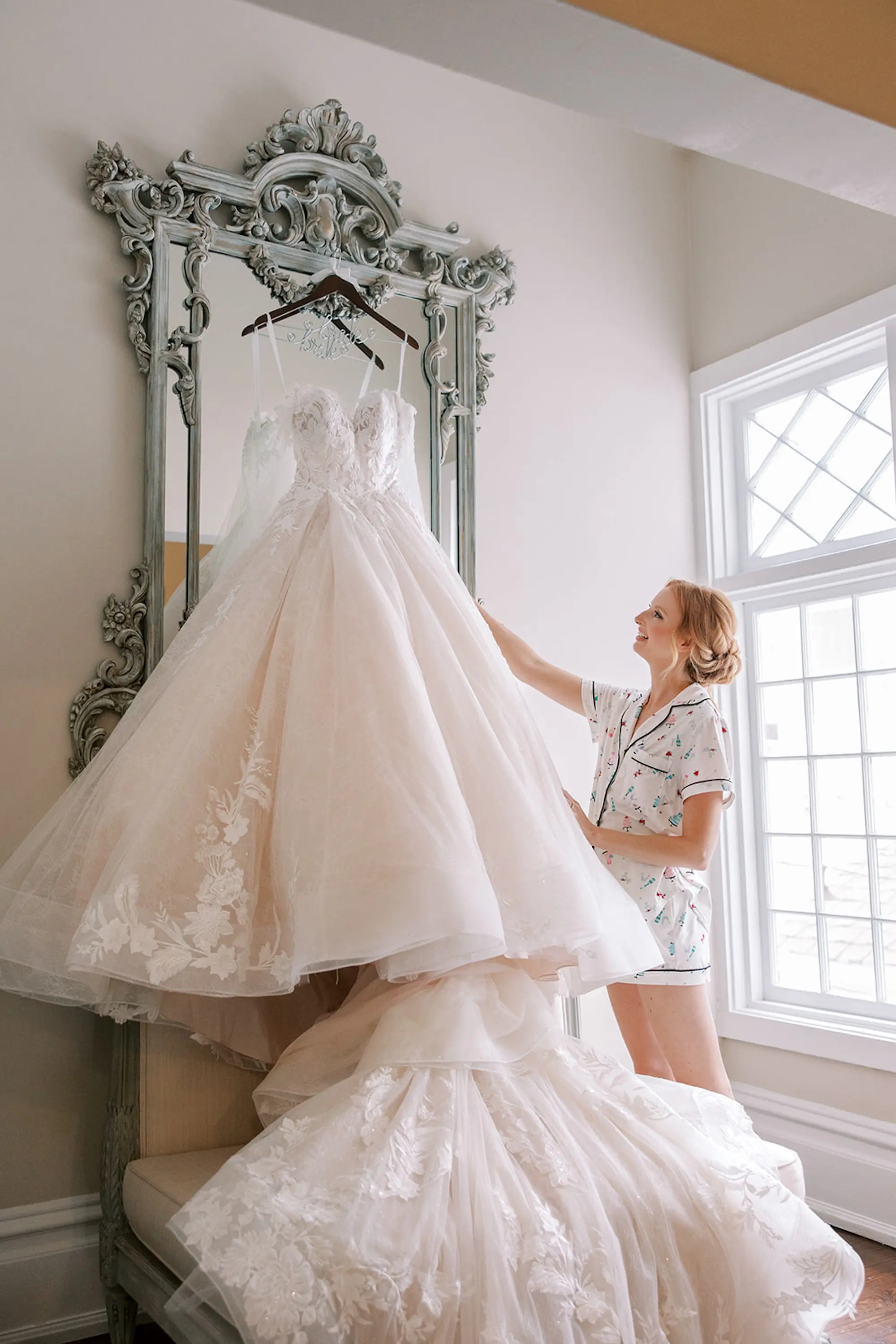 Romantic Rapunzel Allure Bridals Disney Fairytale Weddings White Ballgown Wedding Gown with Sweetheart Neckline and Off-the-Shoulder Chiffon Flowy Long Sleeves Hanging from Vintage Mirror Inspiration | South Tampa Photographer Eddy Almaguer Photography