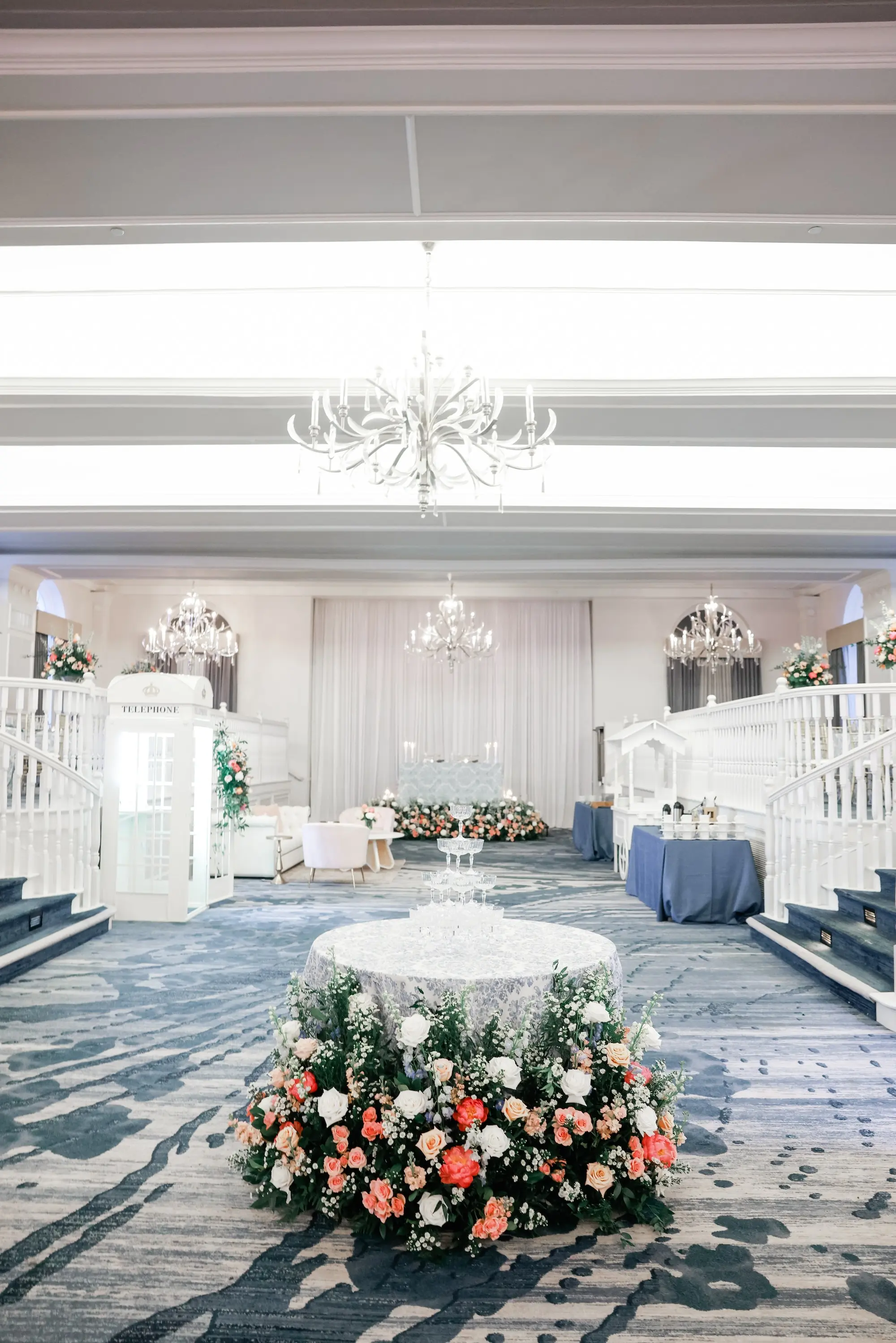 Luxurious Ballroom Wedding Reception | Pink, Coral, Blush Rose Flower Arrangement Ideas | Blue Linens on Cocktail Tables Reception Decor Ideas | Tampa Bay Kate Ryan Event Rentals | Wedding Planner Blue Skies Weddings and Events | Venue The Historic St. Pete Beach Pink Hotel Don Cesar
