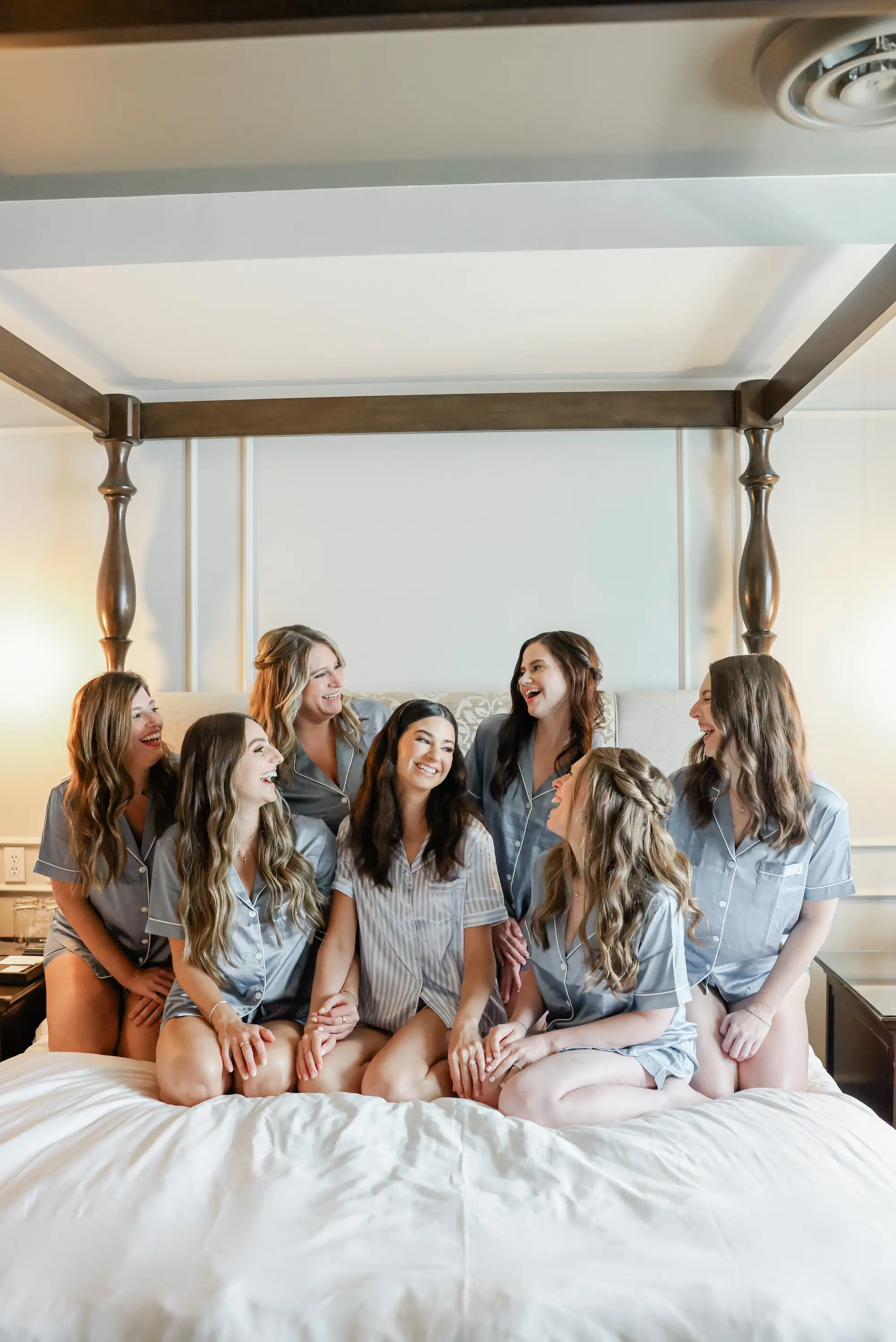 Bride and Bridesmaids Getting Ready Wedding Portrait in White and Blue Striped Matching PJ Sets | Downtown St Pete Boutique Hotel The Birchwood | Tampa Bay Wedding Photographer Lifelong Photography Studio