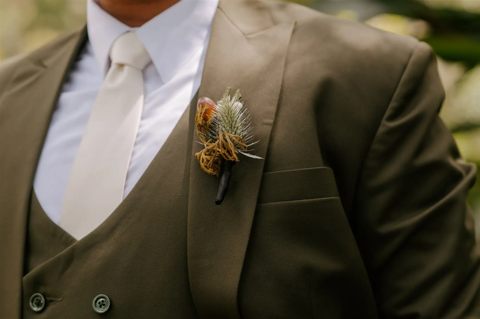 Woodland Inspired Wedding Boutonniere Ideas | Groom's Brown Three-Piece Suit Inspiration