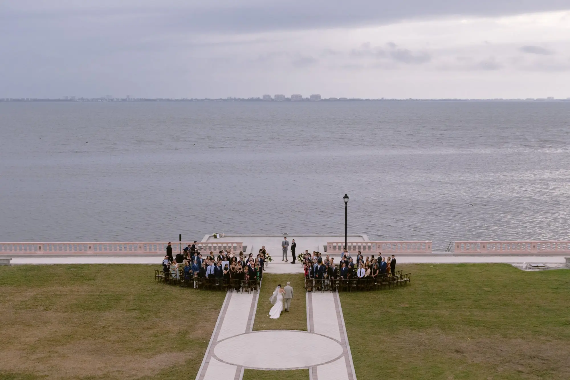 Bride and Father Walking Down Wedding Ceremony Aisle | Overhead Sarasota Waterfront Ceremony Drone Photo Inspiration | Outdoor Lawn Wedding Ceremony Venue Ideas | Tampa Bay Photographer We The Blackwells