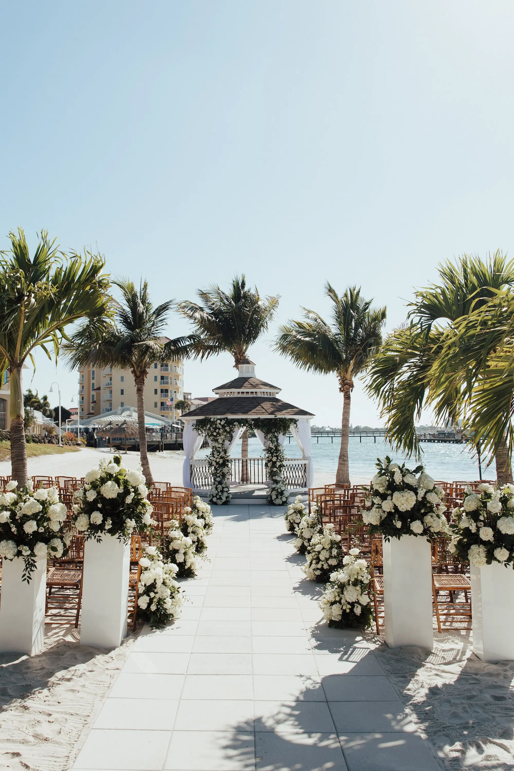 Waterfront Beach Gazebo Outdoor Wedding Ceremony Inspiration | Bamboo Wedding Ceremony Chairs Ideas | White Florals Roses, Hydrangeas Wedding Ceremony Aisle Decor Inspiration | St Petersburg Event Venue Isla Del Sol Yacht and Country Club