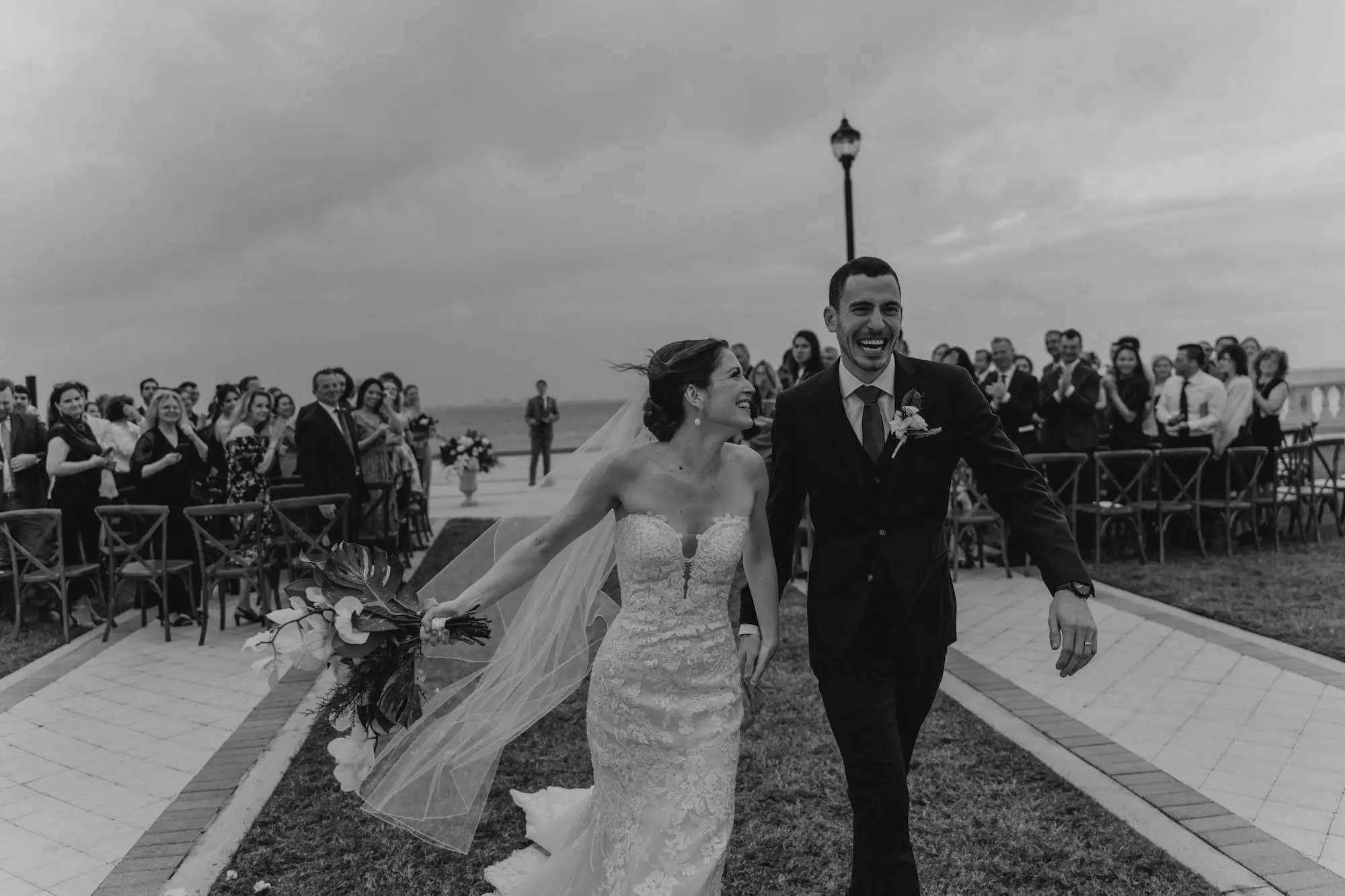 Black and White Bride and Groom Walking Down Wedding Ceremony Aisle Wedding | Outdoor Fall Wedding Ceremony Inspiration | Tampa Bay Photographer We The Blackwells
