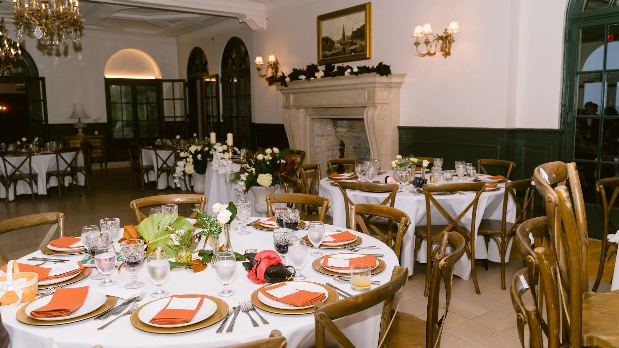 Luxurious Ballroom Wedding Reception | Round Tables with White Linens and Wooden Chairs Wedding Reception Decor Inspiration | Gold Chargers with Burnt Orange Napkins and White Menus Ideas | Fall Florida Wedding Inspiration | Historic Academic Venue The New College of Florida