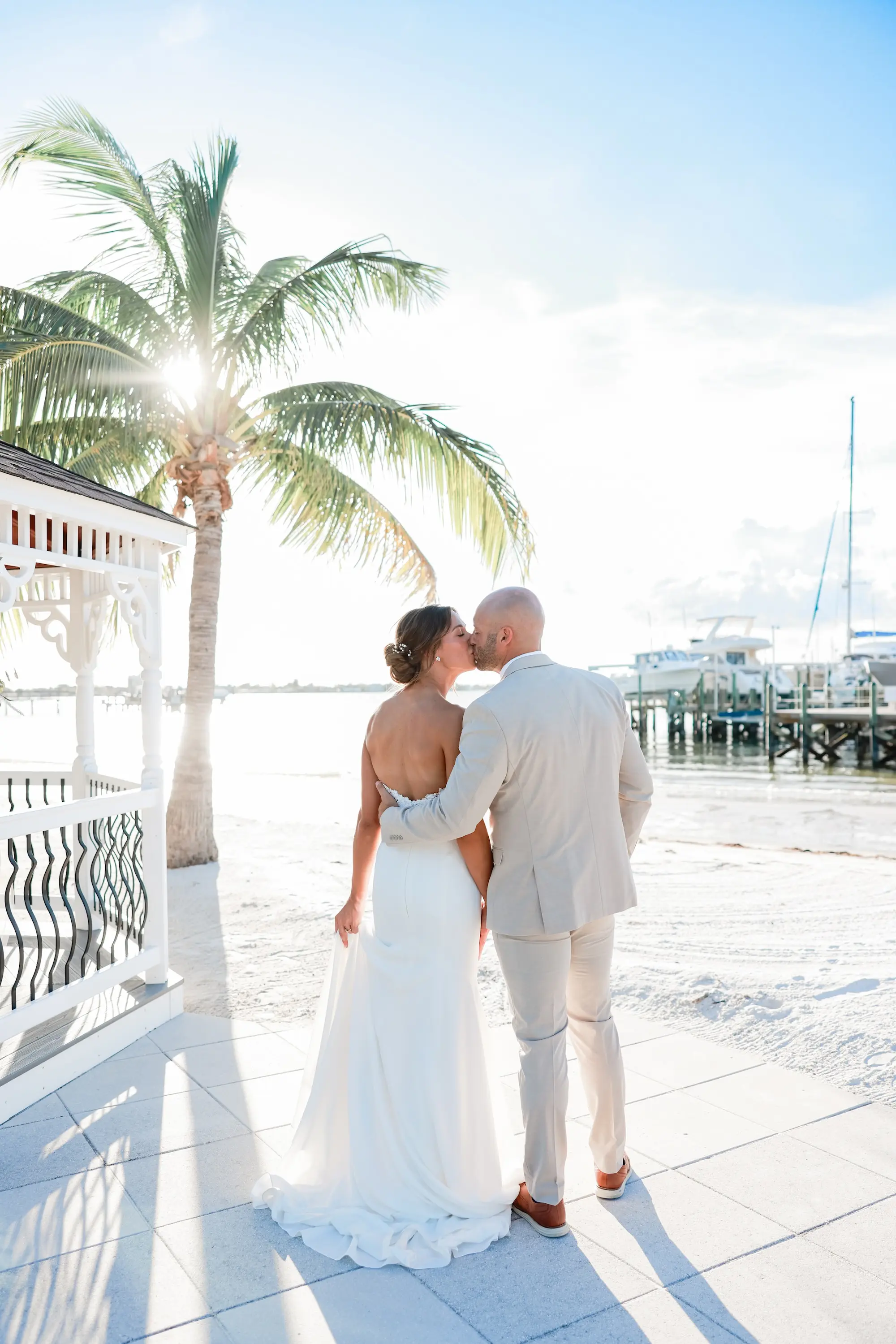 Bride and Groom Kissing on the Beach Wedding Portrait | St Pete Event Venue Isla Del Sol Yacht and Country Club | Tampa Bay Photographer Lifelong Photography Studio