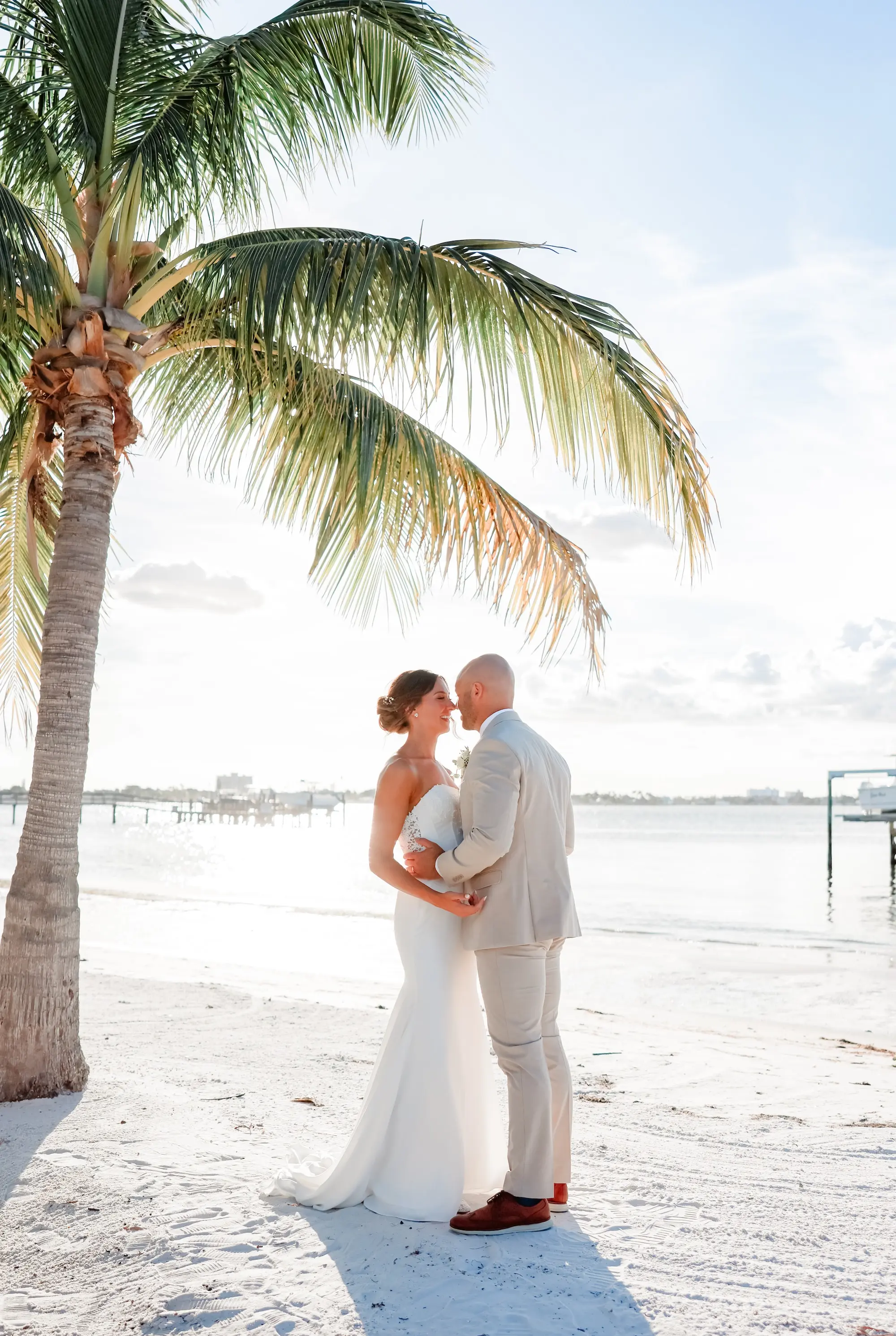 Bride and Groom Kissing on the Beach Wedding Portrait | St Pete Event Venue Isla Del Sol Yacht and Country Club | Tampa Bay Photographer Lifelong Photography Studio